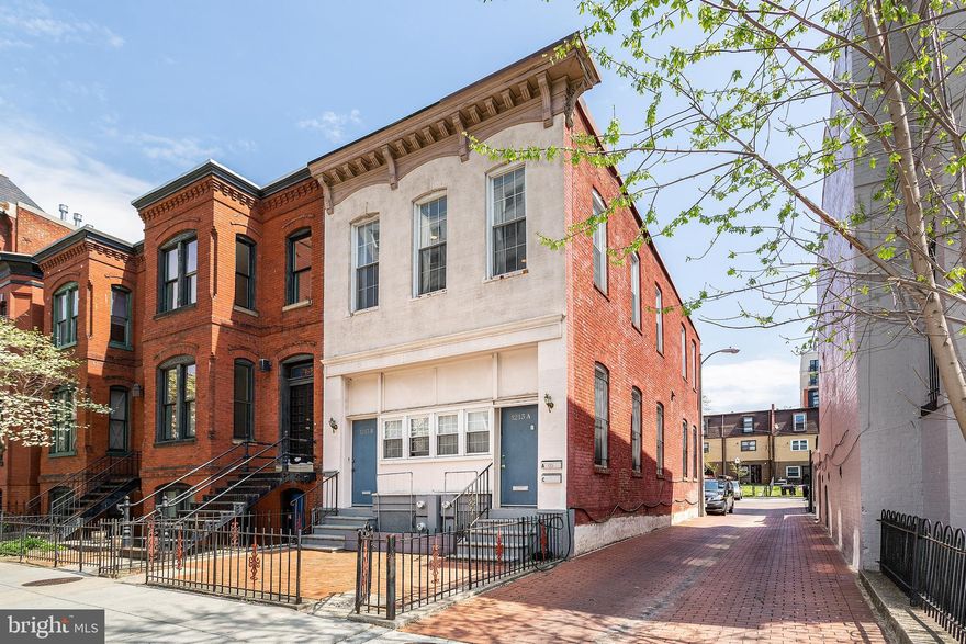 Historic Schoolhouse Conversion | 2BR, 1BA | 1213 12th St NW #A, Washington, DC 20005
Experience modern city living in this rare 2-bedroom residence in a beautifully converted 1865 schoolhouse in the heart of Logan Circle. Unit A offers 1,200 sq ft of thoughtfully designed space with soaring 18’ high ceilings, oversized windows, and rich oak flooring—all drenched in natural light thanks to its bright end-unit position.
Key Features:
•