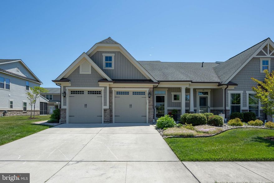 This beautiful, 3 bedroom/2.5 bath Villa is a must see.  From the gorgeous wood floors and eye-catching tray ceilings to the stunning kitchen that features granite countertops, a large island, under-counter lighting, stainless appliances, soft-close cabinets and much more...you will not be disappointed. The Great Room offers a corner gas fireplace trimmed in stone, recessed lighting, crown molding, and a captivating ceiling. The first level Owner's Suite features a tray ceiling with crown molding, a room extension to include a relaxing sitting area, a large Roman Shower in the bathroom, twin vanities with granite counters, a large walk-in California Closet, and beautiful wood floors. The extended outdoor patio is sure to be a favorite. Beautifully landscaped and includes a walkway around the side of the home as well as a trash enclosure. The second level offers a large loft area for added entertainment space, an office/study, or any other additional need you may require. Two more sizable bedrooms, a full bathroom, and a storage room are also located on the second level. You will see the pride of ownership when you tour this stunning home. Don't miss out on this sought-after, two car garage, end unit Villa in Bay Forest. It can be yours in time for the summer fun and festivities, and the community offers so many amenities that are sure to please everyone. Schedule your showing today!