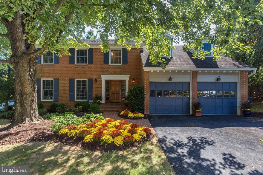 Beautifully updated, mint condition colonial in ideal location w/ Express Bus to Metro * Sun drenched rooms w/ neutral decor * Modern appts throughout * Designer kitchen w/ stainless steel appliances * Master bedroom w/ top of the line new bath * Family rm w/ stone raised hearth fireplace & patio door to private backyard * Parkland across the street w/ walking trail * Blocks to Spring Hill Rec Ctr