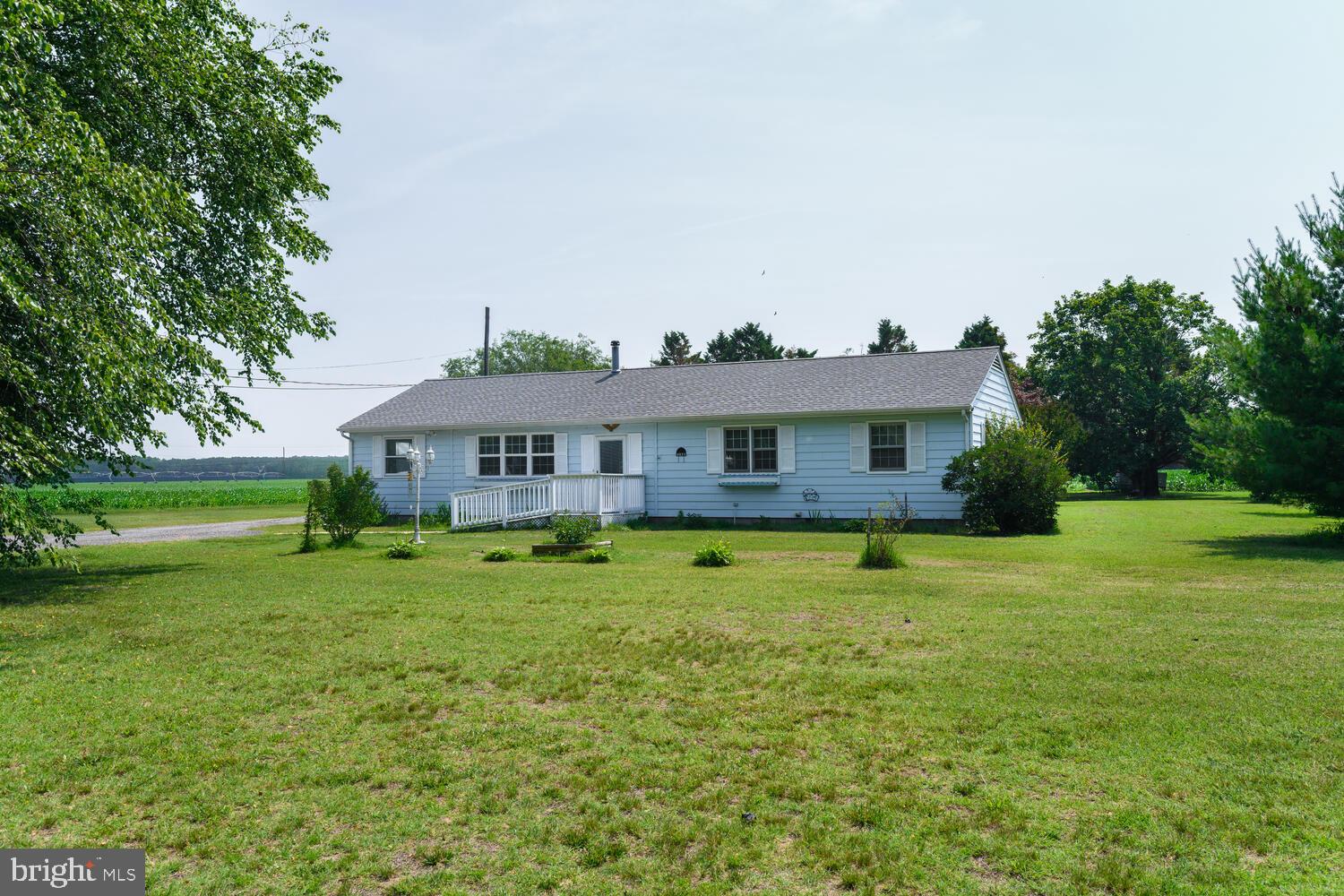 Back on the market through no fault of the seller! Buyer's financing fell through. Listed below last appraised value. Lovingly cared for with many recent improvements make this a special offering. Sited in the center of a nicely landscaped mature lot with farm fields to the side and rear and some nice trees providing privacy. The front entry has a gentle ramp to ease coming and going, bringing you smoothly into the house. Welcome into a freshly painted interior with a comfortable spacious floorplan providing 4 bedrooms, 2 full, fresh bathrooms, laundry/mud room, dining room, living room and flexible gathering spaces that connect nicely to a central kitchen. Flooring is a combo of wood, laminate and new carpet. Step outside the back door onto an amazing deck and Gazebo that grace the rear yard and connect easily to the detached garage/workshop, all overlooking the backyard, farm/fields and BBQ area. A versatile and useful detached garage has generous space for vehicles and a separate workshop with heat for year-round use. Major recent improvements include new roofs and central HVAC, come take a look and make your dreams come true.