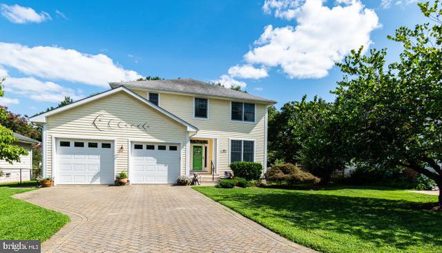 Welcome home to 404 Melvin Ave. This West Annapolis colonial was built in 2011 with attached two car garage and large paver driveway. The first level features hardwoods throughout, large open floor plan with lovely kitchen and island that opens up to the dining and living area. A first-floor office or 4th bedroom and 1/2 bath are nestled away from the living area for privacy while the butler's pantry/mud between the living room and garage offers plenty of storage space as well as a shower for those sandy feet or muddy paws from playing in Weems creek. Stroll out of the living area onto the 3-season porch opening to a huge deck with lounge seating, hot tub, and dining area overlooking the fully fenced in back yard. Enjoy sunny morning cups of coffee and shaded dinners in this backyard oasis. The wide stairway leads upstairs to two bedrooms with walk in closets with a Jack and Jill bathroom. The primary bedroom with trey ceilings boasts a seating area as well as a spacious ensuite and a two-sided walk-in closet. Hardwood floors, huge storage closet for easy access to your holiday decor, and a second-floor laundry room round out the features of the second floor. A fully finished basement with possible in-law suite, a full bath, washer/dryer, kitchen and large family room is perfect for long- or short-term guests. Each floor has an elevator closet for potential elevator install or extra closet space. Solar panels provide utility credits and partial back up power for the home. Ideally located within walking distance to all the charming West Annapolis shops and restaurants. Enjoy kayaking, paddleboarding, boat launch with ease, as Tucker Street Park on Weems Creek is just steps away. This home is also within walking and biking distance to Downtown Annapolis and offers quick access to Route 50 for eas