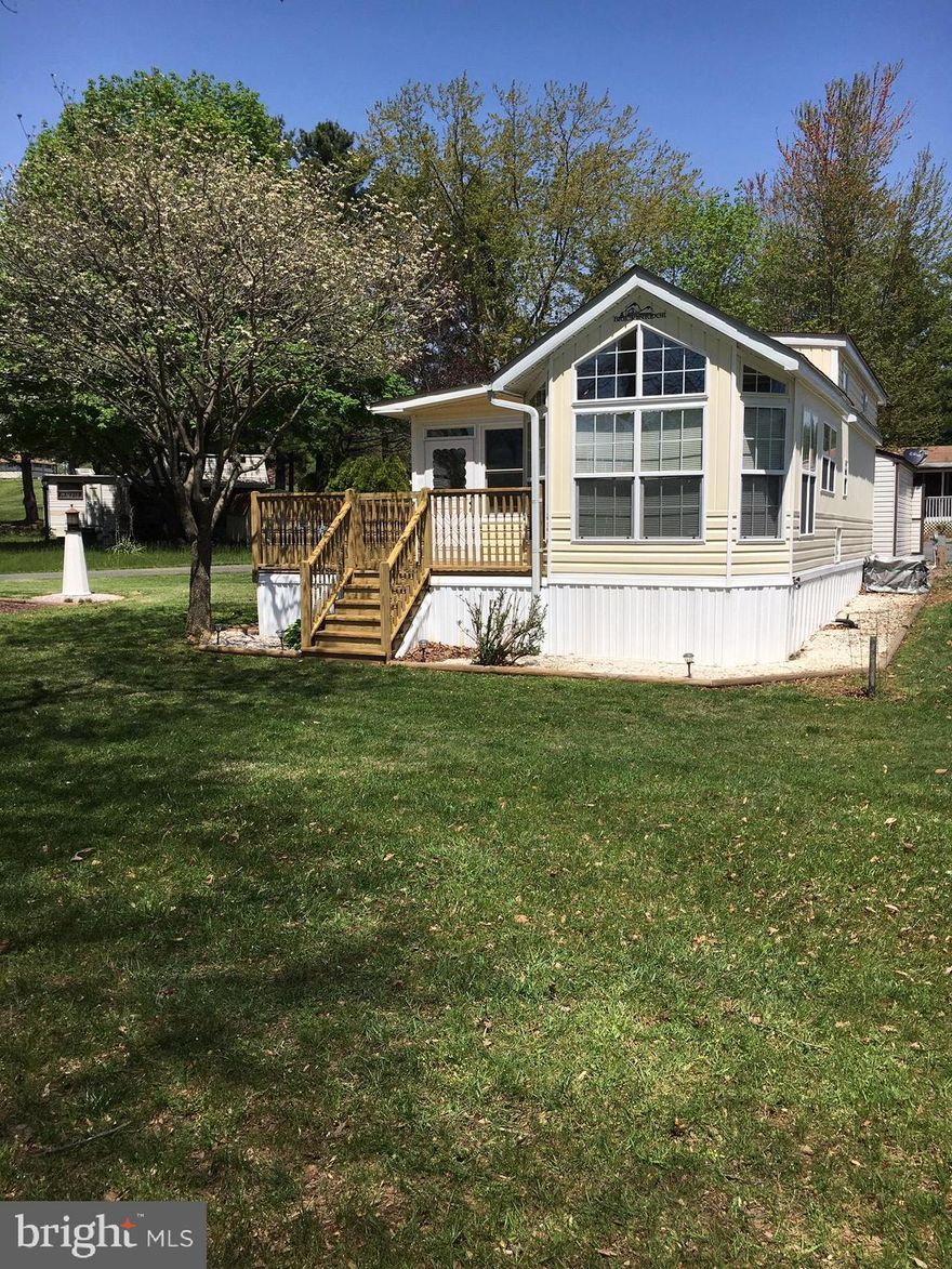 Beautiful well maintained water view property. Upgraded winter package Breckenridge Park Model with an attached/enclosed porch, deck and storage shed.  Includes a gas powered, lifted golf cart with an extra seat (seats 4). Must see property located in Indian Acres Campground which is limited to 150 days a year no more than 100 consecutive days (not a full time residence). Lots of community activities as well. Come see what this location has to offer.