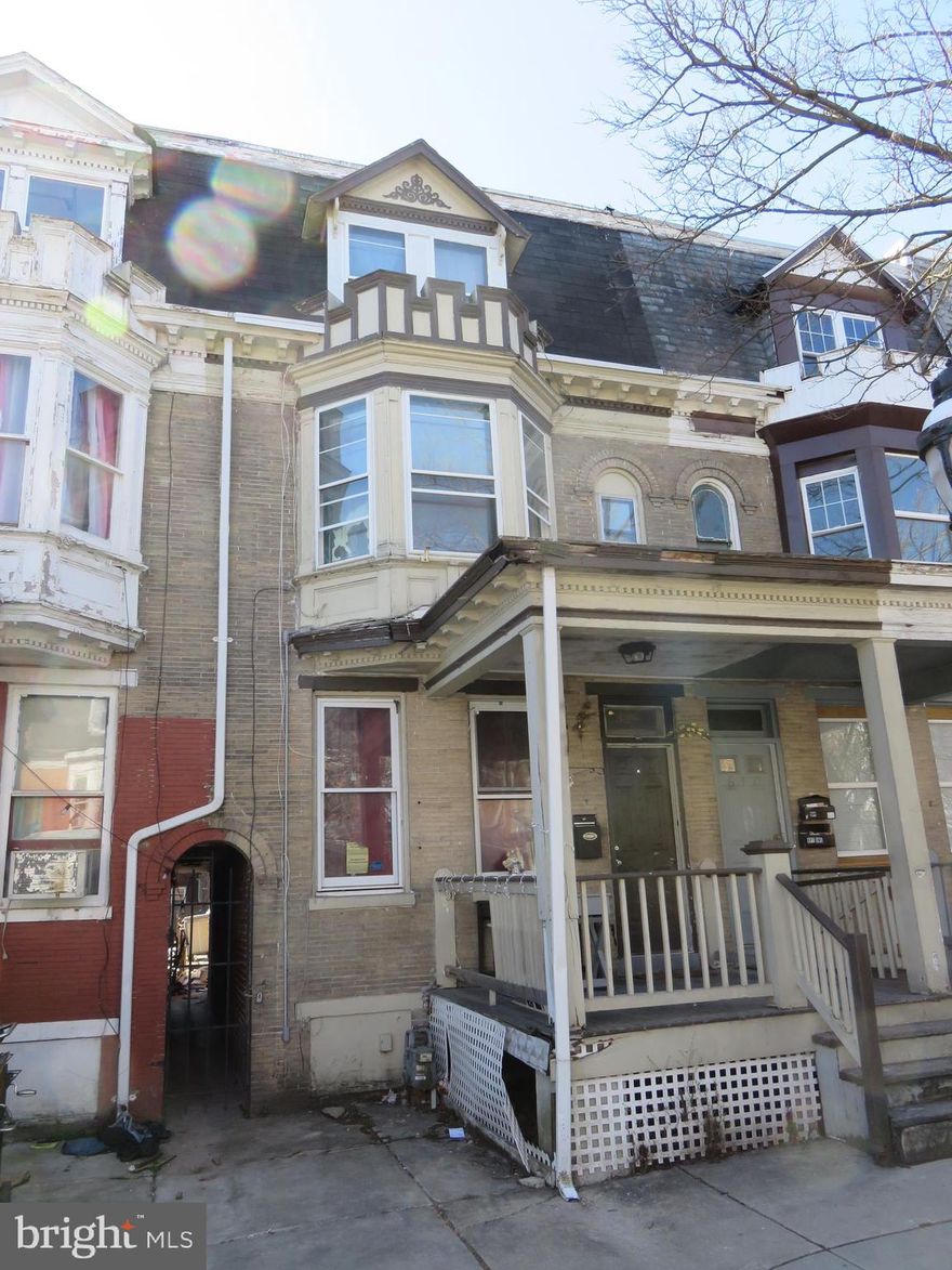 3 Story Brick Townhouse Loaded with Potential and Space.  1st Floor has Living Room  open to Dining Room, Spacious Kitchen and Huge Storage Area off the Back of the kitchen.  2nd Floor has Front Bedroom with Bay window, 2 Bedroom ,  Full bath with Up-Dated Shower /Soaking Tub, 2nd Floor Laundry and Storage Area.  3rd Floor has Spacious Front and Rear Bedrooms. Home is in need of Up-dates and should be Renovated.  Owner is Relocating. Owners can leave 2 Window Ac Units if the Buyer's Want. Property is being Sold "Where Is" "AS IS".