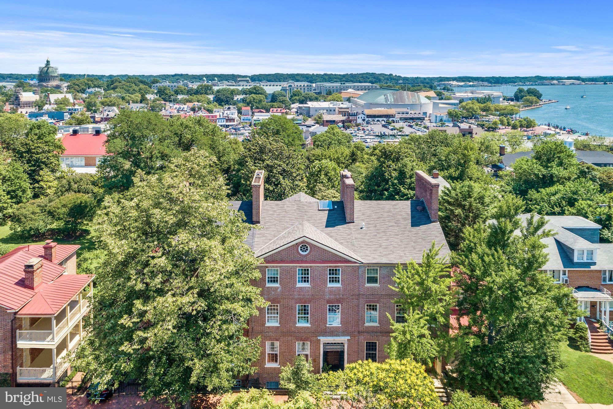 ABSOLUTELY STUNNING! THIS HISTORIC HOME(circa 1774) IS PART OF RIDEOUT ROW BUILT BY JOHN RIDEOUT WITH ITS RICH HISTORY AND ELEGANT REFINEMENTS. SITUATED ON THE LOWER HALF OF DUKE OF GLOUCESTER STREET, THIS HOME IS ONLY A BLOCK FROM CITY DOCK, ANNAPOLIS YACHT CLUB & 3 BLOCKS FROM THE NAVAL ACADEMY. FEATURES INCLUDE GRACIOUS ROOMS WITH HIGH CEILINGS, ORIGINAL WIDE PLANK HEART OF PINE FLOORS, 5 BEDROOMS, 4.5 BATHS, 7 FIREPLACES AND A NEWLY RENOVATED GOURMET KITCHEN! THERE IS A BEAUTIFUL ENTERTAINING BACK GARDEN WITH SLATE PATIO & POND LEADING TO A 2 CAR GARAGE & PARKING FOR UP TO 4+ CARS. THERE IS AN ENGLISH BASEMENT/IN LAW SUITE W/SEPARATE ENTRANCE FROM THE STREET. TOTALLY RENOVATED W/MODERN MAJOR SYSTEMS. COME & ENJOY THIS AMAZING DOWNTOWN LOCATION JUST STEPS TO EVERYTHING!