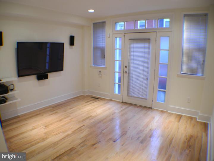 Move In Now! Amazing 3 bed/1.5 bath home in the heart of Graduate Hospital. This home has been renovated from top to bottom with no expense spared. Every detail is brand new including hard wood floors throughout, a large kitchen with granite counter tops and granite floors, stainless steel appliances, dishwasher, garbage disposal, microwave, refrigerator, oven and best of all a 40 inch Samsung flat screen TV already mounted. The living room features a mounted 60 inch Samsung flat screen, built in surround sound, and large windows. Other details include a hi tech ipod/mps audio connection system in every room played through the house's speaker system, a large skylight, patio, balcony,and alarm system. Central air/heat and front load washer and dryer. No Pets