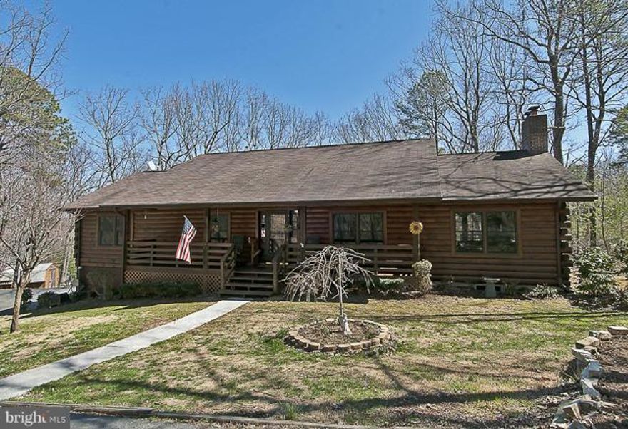 NESTLED AMONG THE MOUNTAINS & THE TREES, PRIVACY AND BEAUTY ON 2.50 ACRES,THIS 4 BEDROOM LOG HOME!  A COOK'S DREAM IN THE OPEN KITCHEN WITH DOUBLE OVENS &  WINDOWS ALL AROUND. WOOD FLOORS, CEILING FANS, BEAMED CEILINGS, SKYLIGHTS, 2 PELLET STOVES. NEST THERMOSTAT, HOT TUB LOCATED OFF THE MASTER BEDROOM, WRAP AROUND DECK FOR VIEWING  GORGEOUS VIEWS, PAVED DRIVEWAY. FENCED BACKYARD. NO HOA!