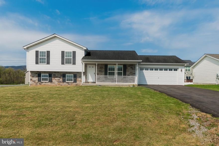 Just reduced to $314,900.00 with a BRAND NEW ROOF!!!  Updated Split-Level Home with Mountain Views on a Corner Lot

Welcome to this beautifully updated split-level home nestled on a desirable corner lot with stunning mountain views. Freshly painted throughout, the interior boasts a modern kitchen featuring brand-new granite countertops, luxury vinyl plank (LVP) flooring, new stainless steel appliances, an oversized sink, and a convenient breakfast bar. The kitchen flows seamlessly into the dining area, perfect for entertaining, with direct access to a brand-new deck and the attached two-car garage.

Upstairs, you'll find three spacious bedrooms, all newly painted with fresh carpeting and updated door hardware. The upper level also includes two full bathrooms, each with new toilets, LVP flooring, and a linen closet in the hall bath for added storage.

The lower level offers an unfinished space, giving you the opportunity to create a custom area to suit your needs. It includes washer/dryer hookups and rough-in plumbing for a future bathroom.

Additional highlights include a newly paved driveway and a charming partially covered front porch—perfect for relaxing and enjoying the view. This move-in-ready home combines modern updates with classic charm—don't miss your chance to own this centrally located gem!