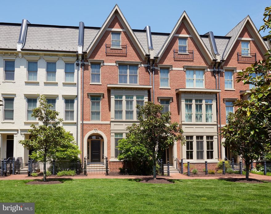 Welcome to this stunning 4-story Elevator townhome located in the prestigious Symphony Park at Strathmore, where luxury meets convenience. With an impressive estimated 3,250 square feet of open living space, this exquisite residence includes 4 spacious bedrooms, 4 full bathrooms, and a convenient half bath and rooftop deck that serves as an ideal retreat. The main floor is versatile, featuring a bedroom that doubles as an office with a full bath—ideal for guests or a private workspace, plus an additional bonus room perfect for a home gym. Effortless access across all four levels is provided by a private ELEVATOR, enhancing comfort and convenience. The 2-car garage offers ample parking and storage. The second level is a culinary enthusiast's dream, showcasing a chef's kitchen with high-end appliances, a breakfast area, and a large island that opens to a family room with a cozy fireplace. The sun-filled living room and separate dining area seamlessly connect to a spacious rear balcony, ideal for entertaining or relaxing. On the third level, you'll find the primary suite with a spa-like bath, along with a secondary ensuite bedroom for added comfort. The fourth level features a recreation area and an additional bedroom with a bath, leading to the large balcony—perfect for gatherings or unwinding. Situated in the award-winning Symphony Park at Strathmore, this townhome offers easy access to the renowned Strathmore Music Center, Grosvenor Metro Station, Whole Foods, everything that Rockville Pike has to offer and major commuter routes. Why wait for new construction when you can own this beautifully crafted townhome by Michael Harris Homes, built in 2013 with high-end finishes and recent updates, offering the ideal blend of elegance and convenience.