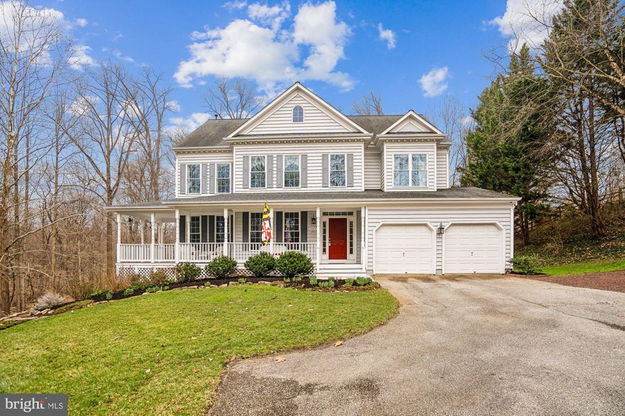 Amazing house in a stunning setting on the 13th hole of The Timbers at Troy Golf Course and surrounded by 10 acres of County preserved wooded open space!  This spacious home with a sought-after open floor plan has spectacular views in every direction - whether it is the picturesque golf course or the stunning mature trees and private wooded setting, it offers the perfect private retreat.  The interior boasts a modern renovated chef’s kitchen with high-end cabinetry, gorgeous Quartz counters and large island, custom hood vent, subway tile backsplash, gas cooking, and large eat-in area with wrap around windows and new modern light fixture.  The sunken family room is highlighted by architectural columns, cozy wood-burning fireplace with marble surround, and eye-catching arched windows, providing more gorgeous views and flooding the space with natural light.  The main level office can also function as a true 5th bedroom with closet, and gleaming hardwoods stretch throughout the dramatic two-story foyer, living, dining and kitchen areas.  The upper level provides a double door entry to the spacious owner's suite with sitting area, huge walk-in closet and generously sized owner's bath with separate vanities and relaxing corner tub.  Three additional generously sized bedrooms, 2nd full bath, landing w/ overlook to the impressive 2-story foyer, and a convenient bedroom level laundry room, complete the upper level. Upgraded trim work including lovely crown molding and 9 ft ceilings are featured on both the main and upper levels.  The lower level provides a bonus room that can function as a private guest area, with beautiful new full bath, and service area with sink, microwave and fridge.  This level also provides abundant storage space with workshop, and walkout French doors to the gorgeous patio and exterior.  Substantial updates include new 75 gallon hot water heater (2021), Leaf fitter heated gutters w/ guards (2022), dual zoned heating and cooling (new HVAC for 1st zone in 2024 & new heat pump for 2nd zone in 2022), and new Roof with architectural shingles & wire snow melter (2013).  Ideal location close to major commuter routes I-95 & 100, and walkable to Watermont Swim Club, Lyndwood Shopping Center, Patapsco State Park, Rockburn Elementary School, and Rockburn Park!  There are a multitude of ways to enjoy the stunning setting of this special property - from the inviting wrap around covered porch, to the large deck, to the expansive brick paver patio with firepit area.  Sited on 0.86 acres, surrounded by nature and peaceful views, this special home is an entertainer's dream inside and out!