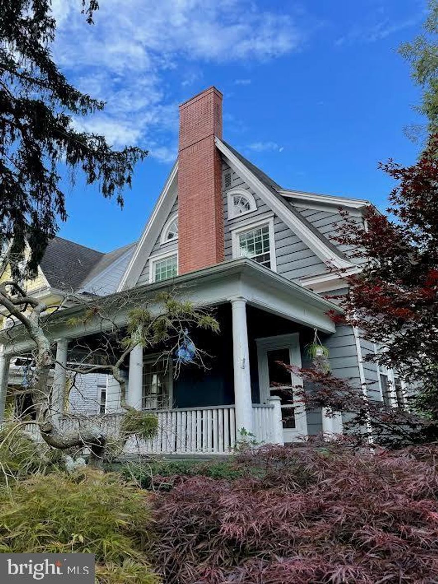A Classic storybook house built in 1901, 5 bedrooms,2 baths with large living spaces. So many details-high ceilings,large rooms,beautifully crafted built-ins. Kitchen has storage closet,pantry and original icebox for winter storage and butcher block counters. Large bay window and built in China hutch in dining room. Fireplace with original glass front bookcases in living room. Original wood floors on second floor along with radiate floor heating in upstairs bath. Two porches for your enjoyment both with swings. Tons of parking, carport,garage and storage unit.  A beautiful stone patio in back with fish pond. Workshop in basement and cedar closet in attic. Original charm and workmanship combined with modern updates !  A rare gem indeed.