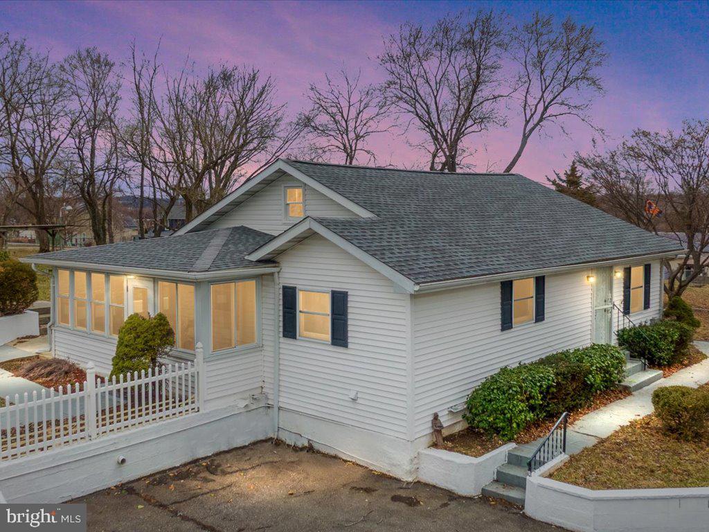Come see this private and secluded one-of-a-kind property in North Linthicum. This adorable and updated home offers one level living and sits on .67 acres (with exclusive use of an additional .24 acres, totaling .91 acres of land). Updates include fresh paint, luxury vinyl plank floors throughout, newer roof, new HVAC system and updated baths. Spend your time outdoors in the spacious and serene yard that offers plenty of room for entertainment, outdoor recreation and gardening, a true nature lover’s paradise. Or relax in the bright and airy sunroom enjoying your morning coffee, doing yoga, relaxing or reading a book. You can truly have the best of both worlds with modern conveniences all offered in this simple one level floorplan as well as your own outdoor paradise. Plenty of outdoor storage is also offered on the property, as well as a walk-in lower level “crawl space” and large attic. This home has so many amazing features and is convenient to schools, major routes, restaurants, and entertainment. This stylishly updated and affordable home is a rare find and won’t last long, schedule your showing today.