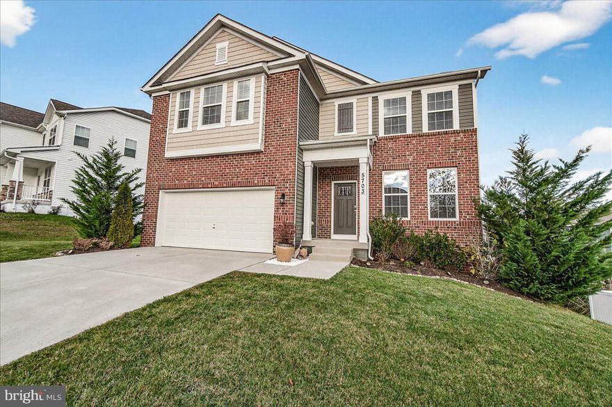 5703 Guilford Garden Terrace bathes in natural light from sunrise to sunset and seamlessly blends comfort, style, and functionality. This is the most popular floorplan in the Preserve at Long Branch by D.R. Horton, offering over 4,800 sq. ft. of beautifully finished living space.  Step inside to discover 5 bedrooms and 5 full bathrooms, including a rare main-level guest suite with a luxury full bath—perfect for multigenerational living or visiting guests. Enjoy morning sunrises from the deck or kitchen and unwind under star-lit evening skies.  The main level features durable luxury vinyl plank flooring, upgraded modern lighting, and an inviting open-concept layout. The gourmet kitchen is a chef’s dream, boasting stainless steel appliances, quartz countertops, an upgraded backsplash, and a spacious island ideal for meal prep and entertainment. A dining room, a bright family room, a walkout to the expansive composite deck with solar lighting, and a 2-car garage complete this level.  Throughout the home, the owners have added thoughtful upgrades and smart-home features, including premium lighting, updated ceiling fans, and custom closet organizers.   Upstairs, the expansive primary suite includes a sitting area, a spa-like en-suite bath, and a generous walk-in closet. Two additional bedrooms, a full bath, an upper-level loft/family room, and a convenient laundry room complete the second floor.  The walk-out lower level is an entertainer’s paradise, showcasing a spacious recreation room, a custom built-in electric fireplace with lighted shelving and TV mount, a bedroom with full luxury bath, abundant storage, and access to the custom stone patio with a retaining wall, white vinyl fencing, and stunning landscaping. A water softener is also included.  
Located in the highly sought-after Oakdale School District, this home offers easy access to major commuting routes, shopping, restaurants, and Historic Downtown Frederick.  Don’t miss your chance to make this breathtaking home yours!