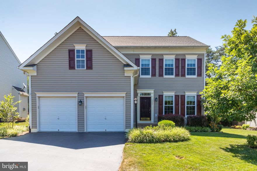 Sitting on a cul-de-sac lot, across from community walking trail access, this Yardley model with three finished levels is ready for you to make it your Next Home! On the main floor: all wood floors an extended family room with built-ins and a gas fireplace a kitchen with a soaring ceiling, stainless steel appliances and Corian counters formal dining room and a sitting/living room two tier deck off of the family room overlooks the treed rear yard. On the 2nd floor: a huge owners  suite with a custom walk-in closet and a luxury master bath with a soaking tub, updated shower and double sinks 2 additional large bedrooms (one with custom closet) and a hall bath. On the lower level: a large laundry room, a gaming  nook  or hobby/play room, and a large rec room with a wet bar. The basement walks up to the rear yard. Some improvements made by the Sellers: new roof (2017), some gutter covers (2019), new windows (2010), refinished and added wood flooring on main level (2017), new LVT in lower level (2018), new hot water heater (2015), new HVAC (2013), new sump pump (2016), closet customization by ClosetsByDesign, and master shower update. The lot features native landscaping and lots of documented wildlife (list available on request). FIOS available.