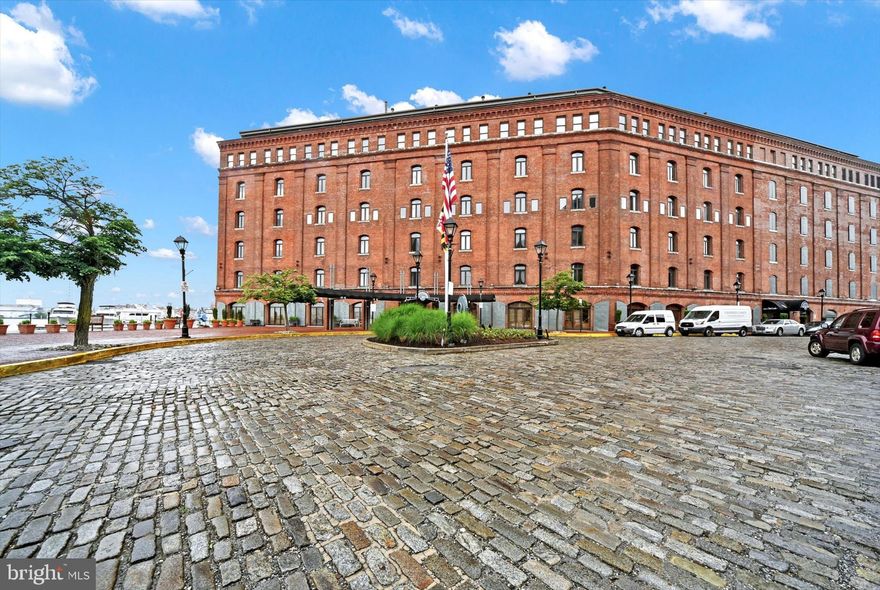 Welcome to Henderson's Wharf, where luxury meets waterfront living in the heart of Baltimore's vibrant Fells Point neighborhood! This stunning condo has been newly renovated to provide comfort and style at every turn. Step inside to discover a meticulously designed 1-bedroom, 1-bathroom oasis. The updated kitchen is a chef's dream, featuring Calacatta River Gold countertops and high-end appliances. High-grade flooring runs throughout, offering both durability and elegance. Ample storage awaits with custom closet shelving on both the main and upper levels. Upstairs, your cozy bedroom and full bathroom boast exquisite details, including a Restoration Hardware vanity and medicine cabinet, adding a touch of sophistication to your daily routine. Henderson's Wharf offers an array of premier amenities, including a deeded parking garage space, a 24/7 concierge desk, secure elevator access, meeting and party rooms, a fitness center, and a picturesque courtyard for enjoying the outdoors. Plus, take advantage of exclusive perks like discounted hotel rooms at the Inn for out-of-town guests. Nestled in historic Fells Point, a waterfront neighborhood known for its charming cobblestone streets, vibrant nightlife, and rich history, this residence is just steps from renowned restaurants, boutique shops, and lively entertainment. Experience the best of waterfront luxury in Baltimore—schedule your private showing today!