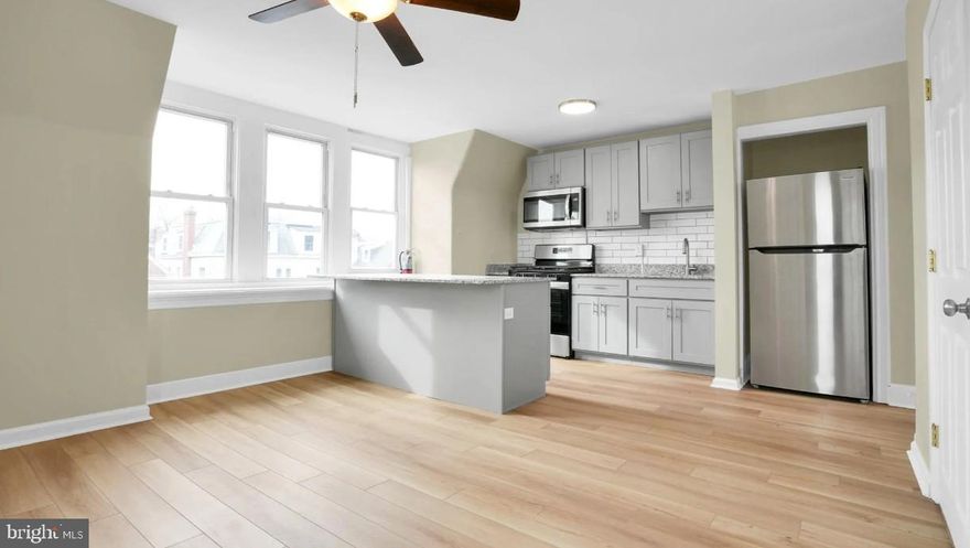 Step into this beautifully updated third floor 1-bedroom, 1-bath apartment featuring granite countertops,  stainless steel appliances, a sleek kitchen island, spacious living room and cozy bedroom. Enjoy year-round comfort with mini-split heating and cooling system, keyless entry, and the convenience of a shared washer and dryer. The private, partially fenced-in backyard adds a rare touch of outdoor space. Hot/cold water, sewer, and trash services are all included in the rent price. Tenant pays electricity, wifi/cable, gas for cooking. Nestled just steps away from Phoenixville’s vibrant dining, boutique shopping, parks, and entertainment—this location truly has it all. Schedule your private tour today! Small pets are welcomed with additional fees and on a case by case basis. Non-Smoking/Non-Vaping Property!! Showings begin 5/1.