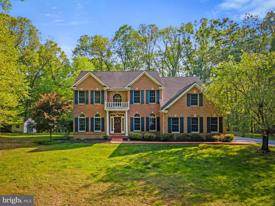 Sited on a beautiful and private 7.98-acre lot, 23 Esther Ann Way is the warm and welcoming home you’ve been waiting for. This 4-bedroom, 4.5-bath home offers over 6,000 sq. ft. of beautiful living space, providing a wonderful woodland retreat nestled in nature, with all the amenities you’ve hoped for.  

The custom-built home was thoughtfully designed to suit today’s lifestyle, combining both formal and more casual living areas that cater to a multitude of lifestyle needs.  Enter the bright, two-story foyer, which graciously opens to the living, dining, and family rooms, as well as the home office, offering a gracious flow throughout the main level. The living room has beautiful built-ins, and the dining room provides ample space for more formal entertaining. There is a seamless connection from the family room, complete with a wood-burning, stone fireplace, to the bright and beautiful kitchen.  Highlights of the kitchen include an expansive island with a breakfast bar, granite countertops, a 6-burner stove with a pot filler, ample cabinetry storage, and a dining area for more casual meals.  French doors and windows line the kitchen, flooding the room with natural light and connecting to the outdoors.  A convenient laundry room and mudroom are located just off the kitchen and connect to the two-car garage. 

The upper level is accessible via a main and back staircases and features a spacious primary suite with a gas fireplace, sitting room/office, a large en-suite bathroom equipped with a separate soaking tub and shower, and two walk-in closets. Two additional bedrooms, with a connecting full bathroom, as well as a fourth bedroom with an ensuite bathroom, provide an ideal space for family and guests. 

An open staircase leads you to the well-finished lower level, featuring a generously proportioned space adaptable for various uses, such as a family room, recreation, or game room. There is also a coveted fitness room that can be utilized as a media room, complete with pre-wired surround speakers. You’ll appreciate the wet bar built-in with a beverage refrigerator, microwave and beautiful cabinetry, making entertaining effortless.  An additional full bathroom and a spacious utility room with ample space for a workshop and extra storage complete the lower level. Glass doors allow for natural light, and walk-out stairs lead directly to the yard. 

Outdoor living is a delight, with beautiful, mature trees that bloom at various times of the year, enhancing the stunning landscape that spans nearly 8 acres. You’ll love the 2-tiered Trex deck, complemented by stone patios and a fire pit, all set amidst a lush yard. Privacy abounds! This sanctuary is a gardener’s paradise and the perfect setup for hosting magical gatherings and play.  The property also has a delightful ½-mile walking trail for nature enthusiasts. An electric fence surrounds the tree-lined area in the rear of the home and the front yard.

This exceptional property combines a fabulous design with gorgeous interiors and exteriors, making it a truly remarkable place to call home.