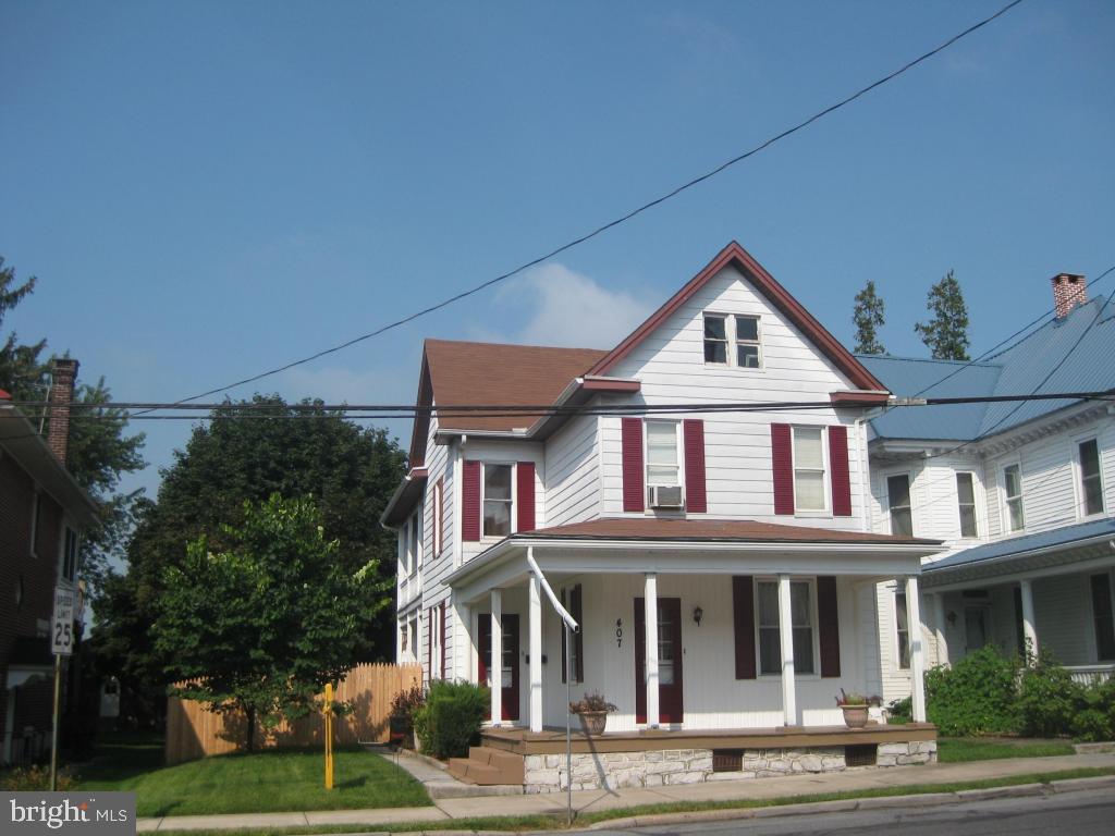 Looking for a home with a huge kitchen + spacious rooms? This home has just that. 33 handle kitchen with appliances, beautiful LR w/ open staircase/stained glass window, tongue & groove ceiling, 1st flr FR, as well as partially finished additional FR in the LL. New bath in 2012, new carpet in BR 2+3, many replacement windows. Pellet stove heated the home for $800 this past winter. MUST SEE!