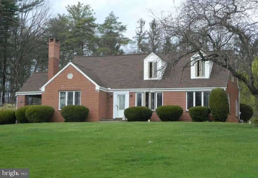 Conveniently located with easy access to I-99 via the Zion Road exit, and just a short drive to Penn State and I-80, this exceptional brick Cape Cod offers the perfect blend of accessibility and peaceful retreat. Set back on a gently rising 1.7-acre lot, the home sits atop a scenic knoll, capturing great views and offering a sense of privacy as well. 

From the moment you arrive, the property’s curb appeal stands out, highlighted by a long asphalt driveway leading to this tucked-away setting. The expansive front yard provides a natural buffer from the road and ample space for recreation, while the backyard transforms into your own private oasis. Enjoy summer days by the in-ground pool, or take advantage of the detached garage, mower garage, workshop, and large rear carport (20' x 17')—perfect for hobbies, storage, or entertaining. Fruit trees and garden space add to the charm, creating a truly self-sufficient and serene environment.

Inside, the home welcomes you with spacious rooms designed for both comfort and functionality. The kitchen is a standout feature, complete with granite countertops, a center island, tile backsplash, and an open layout that flows seamlessly into the formal dining area—ideal for gatherings. The oversized living room features a cozy wood-burning fireplace, while a separate den offers added privacy, built-in speakers, and privacy windows.

The first-floor owner’s suite provides a private retreat with a walk-in closet, additional closet space, and a luxurious ensuite bath featuring a jetted tub, walk-in shower, dual vanity, and linen storage. Main floor laundry with durable LVP flooring adds everyday convenience.

Upstairs, you’ll find three generously sized bedrooms, a full bath, and a charming 5' x 8' cedar closet for additional storage. The lower level expands your living space with a finished family room and half bath, along with unfinished areas for storage and mechanicals.

This property offers the ideal balance—spacious enough for entertaining and everyday living, with land to explore, garden, and unwind—yet close enough to everything to keep you connected. How rare to find such amenities, space, and class.  Schedule right away so you have no regrets later!