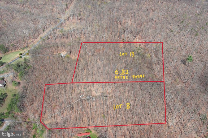 MOUNTAINEER STARTER KIT....6.82 WOODED ACRES COMPRISED OF LOTS # 8 & 13 OF PEACEFUL VALLEY ESTATES. LOT 8 HAS A 300 FT DRIVEWAY INSTALLED TO CAMP/BUILD SITE OFFERING GREAT VIEWS OF SHORT MOUNTAIN AND PASTURE OF NEARBY FARMS. LOT 8 HAS ALSO BEEN PERKED AND HAS AN EXPIRED SEPTIC PERMIT ON FILE, HOLE FOR SEPTIC TANK ALREADY DUG. LOT 13 ALSO OFFERS GREAT VIEWS AND HAS A DRIVEWAY IN PLACE TO A SMALL CLEARING. ELECTRIC AT BOUNDARY OF BOTH LOTS. WHEN COMBINED THESE LOTS OFFER DEAD END OF THE ROAD PRIVACY AND ENOUGH SPACE TO HUNT & SHOOT. NOT BAD TOPO AND COVERED IN HARDWOODS. ONLY A 1/2 MILE OFF THE PAVED ROAD AND 5 MINUTES FROM "SHORT MOUNTAIN WILDLIFE MANAGEMENT AREA" 8000 ACRES OF PUBLIC HUNTING & HIKING AND 5 MINUTES FROM TROUT FISHING ON NORTH RIVER. BUILD HERE, CAMP HERE, PLAY HERE....BRING A FRIEND OR FAMILY MEMBER, IT'S 2 LOTS. YOU'RE ALREADY AT LEAST 5K AHEAD ON INFRASTRUCTURE COST WITH THE DRIVEWAYS IN PLACE. OLDER DEVELOPMENT WITH MINIMAL FEES & RESTRICTIONS. 55K IS  A SMALL PRICE TO PAY FOR 2 SLICES OF HEAVEN!
