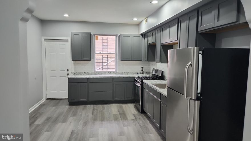 Fully  updated town house with finished  basement,central air,new kitchen cabinets,and much more