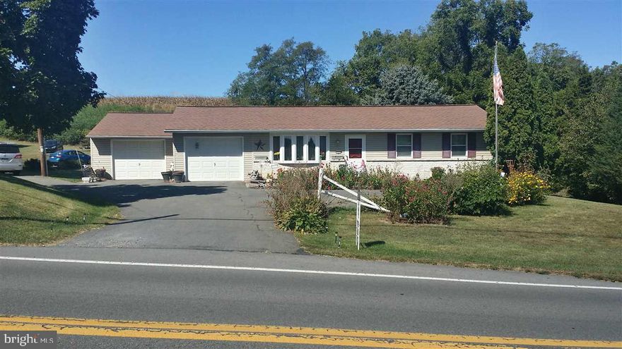 Garden Fresh Veggie, Farm Fresh Eggs, & a Country Store...this home is in a country community that has it all! This beautiful country home is situated on over an acre of land adjacent to farms. Large pole barn on property w/electric is perfect for the car collector, mechanic or possibly a guest house. Inside are 3 bedrms, 1.5 baths & a beautifully finished bsmt W/gas FP. Many upgrades & improvements including blue light water purification sys. Only 35 min frm Harrisburg, this home has all country charm.