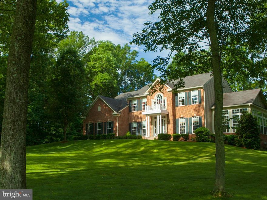 Truly exceptional; a Showplace. 3 level Brick front colonial, 5000+sq. ft. beautifully maintained + sited in a park-like  private. setting in Breckenridge N.  cul-de-sac.Sun room,bump out kitchen. Granite counters. Ceramic tile.  In-ground pool. Large decks off kitchen/sun room. Light filled. Open floor plan. Big Rooms. Mature trees. Professional landscaping.  Huge fin. basement.MARC TRAIN 5 MINS