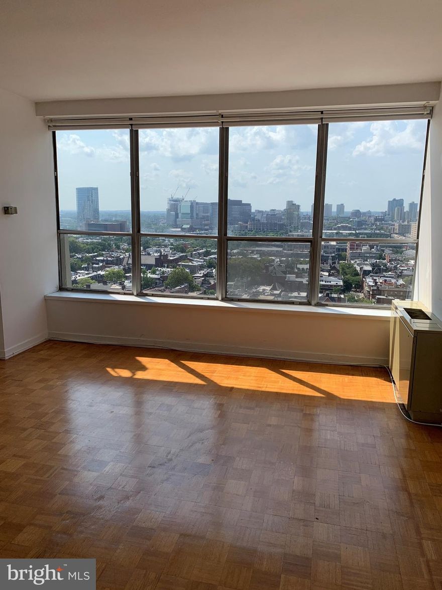 Beautifully updated studio on a high floor of The Dorchester, located on the west side of Rittenhouse Square. This charming home offers an open great room beaming with natural light from a wall of oversized windows showcasing see-forever sunset city views. Adjacent to the great room is the fully updated kitchen with white cabinets, granite countertops, white tile backsplash, new tile floor, and stainless steel appliances. The updated bathroom has a single white vanity with granite top, new tile floor, and a white tiled tub shower. There are parquet wood floors in the great room and an oversized walk in closet. Residents of The Dorchester enjoy a twenty-four hour doorman and all utilities are included in the condo fee. Use of the building’s state-of-the-art fitness center, seasonal rooftop pool club, and valet parking in the building’s underground garage are available for an additional fee (subject to availability). No pets permitted. Location is everything...Rittenhouse Square was ranked the 6th best neighborhood in North America with 175 restaurants and 199 retailers within a three block radius. Be within close walking distance to the Market Street office corridor, The Avenue of the Arts and University City. 30th Street Station and Philadelphia International Airport are only minutes away.