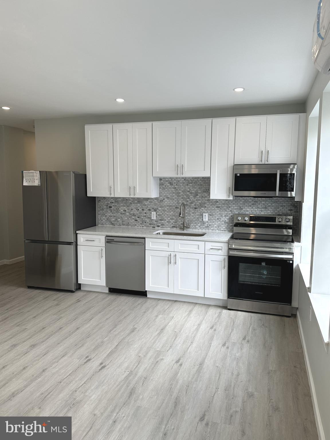 Experience modern city living in this beautifully and fully renovated 2 bedroom, 1 bathroom apartment, located in the heart of historic Germantown. This bright and spacious apartment features large windows and an abundance of natural light. The fully updated kitchen is a standout, complete with stainless steel appliances, quartz countertops, and contemporary cabinetry - perfect for anyone who enjoys cooking and entertaining. Both bedrooms are well proportioned with generous closet space. The modern bathroom is sleek and functional. The apartment is heated and cooled using three brand new and highly efficient mini split HVAC systems. Feel the warmth in the winter and the icy chill in the summer. Fully renovated and brand-new apartments like this do not come along often. Take advantage of the opportunity to live in this prime Germantown Avenue location, situated directly across the street from the beautiful Wyck Historic House and Garden , a national landmark.