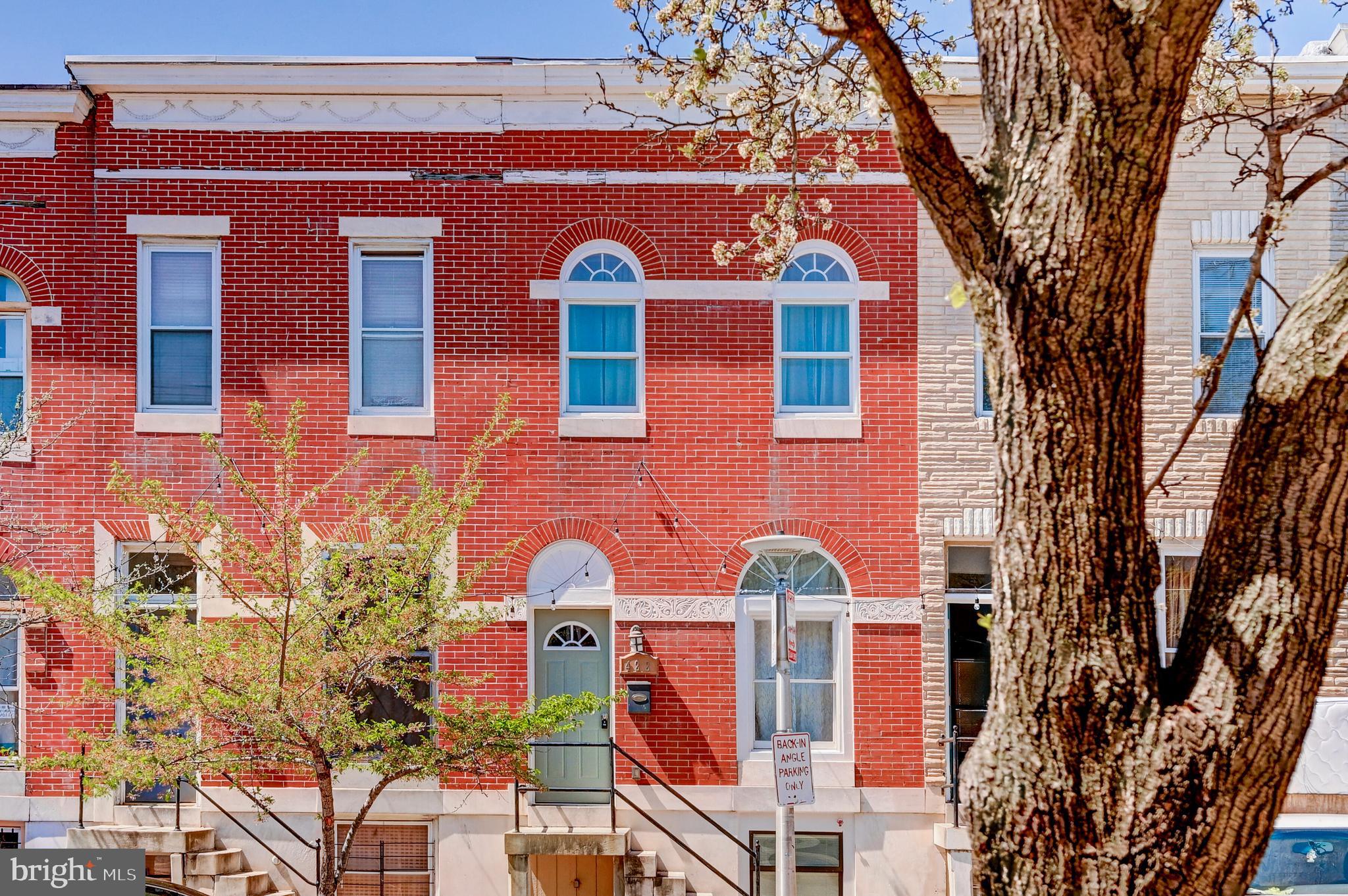 Welcome to 422 N Luzerne Avenue, a beautifully updated 2-bedroom, 2.5-bath home in the heart of East Baltimore! This charming brick-front rowhome offers the perfect blend of historic character and modern finishes, starting with convenient angled parking right out front — no more circling the block! Step inside to a bright, open-concept layout with great natural lighting and spacious flow. The modern kitchen boasts sleek granite countertops, stainless steel appliances, and plenty of cabinet space — perfect for cooking and entertaining. The home also features elegant flooring, updated lighting fixtures, and neutral tones throughout, making it truly move-in ready. Upstairs, you'll find two generously sized bedrooms, each with access to updated full bathrooms for ultimate privacy. The rear bedroom includes a private balcony, offering a peaceful spot to unwind with your morning coffee or evening book. The private enclosed backyard is ideal for summer BBQs, pets, or a quiet retreat. Located just minutes from Johns Hopkins Hospital and within walking distance to Patterson Park, you're also a short ride from Canton’s vibrant waterfront, shops, and restaurants. Don't miss your chance to own a beautifully updated home in a prime Baltimore location! *Home is being sold AS IS *