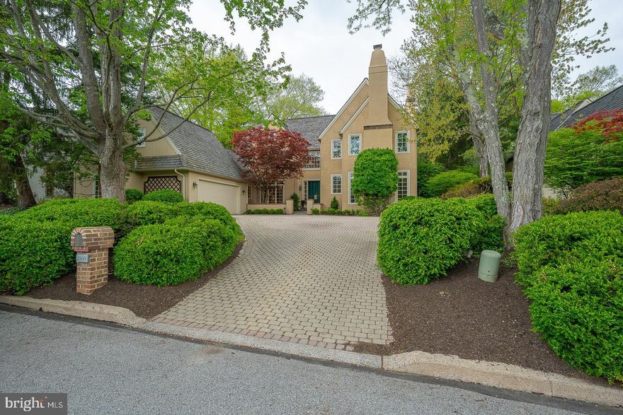 Nestled within the highly sought-after enclave of Denbigh in Wayne, this stunning 3-bedroom, 3.5-bath residence offers a rare blend of elegance, privacy, and natural beauty.  Inside, a dramatic two-story foyer welcomes you with gleaming hardwood floors and abundant natural light.  The thoughtfully designed floor plan flows effortlessly with a large formal living room and handsome office to the right, and a lovely formal dining room to the left.  The back of the house holds the charming eat-in kitchen and fireside family room.  The original breezeway leading to the garage was thoughtfully renovated into a wonderful space used as a mudroom/office/laundry area.  Upstairs, the luxurious primary suite is a private retreat with 2 walk-in closets and a spacious bath.  Two additional generously sized bedrooms each offer their own en-suite bathrooms, one with a cedar closet. Step outside to the large bluestone terrace with a beautiful koi pond and waterfall, a perfect space for quiet mornings or entertaining all summer long. This is a rare opportunity to enjoy refined living in an exceptional community, just minutes from upscale shopping and dining in downtown Wayne, major roadways, top-rated schools, country clubs, and much more.