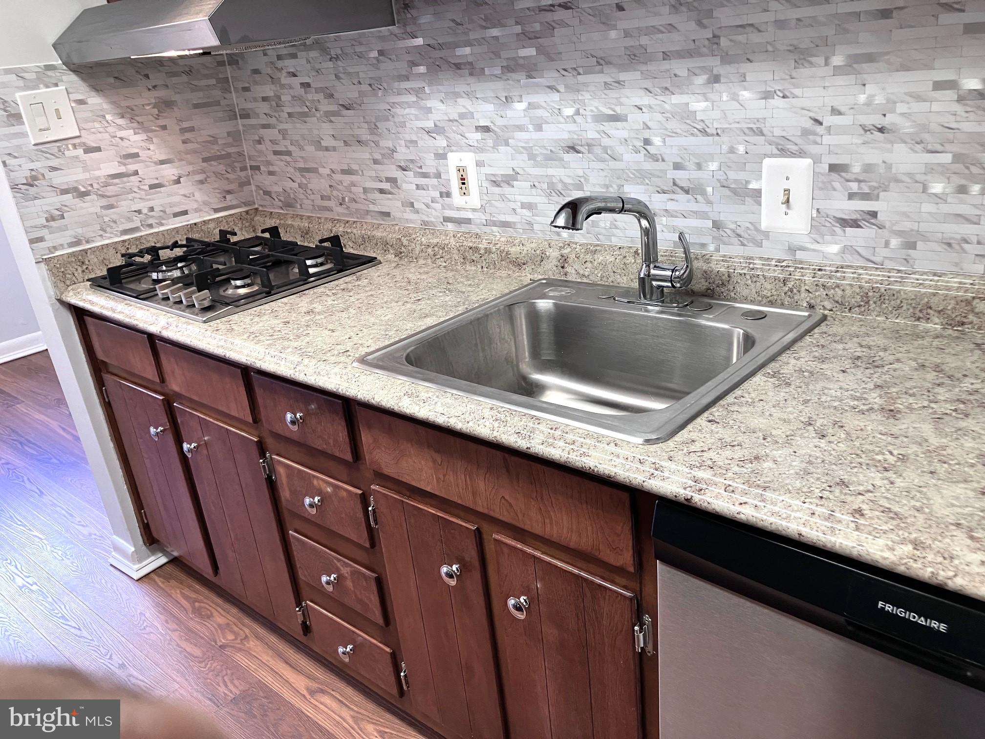 NEW PRICE ! RUN Don't WALK ! Newly-Renovated & READY for YOU ! Literally a 3-5-MINUTE STROLL to the METRO @ Grosvenor-Strathmore, ACROSS the STREET from your place & thru the Rockville Pike Under-Pass ! Low condo fee includes variety of amenities, Internet & Cable, Gas & Electric, Pools, a playground, Tennis courts, Grosvenor Market, a convenience store (which is more like a mini grocery store), and scenic walking trails. Located just minutes to the Music Center at Strathmore and the vibrant Pike & Rose development This Light-Filled unit Welcomes you home to Peaceful Pond & Treed VIEWS of Green-Space from your Balcony, and/or Dining-Area...as well as Green-Space, Treed VIEWS from the owner's Bedroom-Suite. The updated Kitchen offers NEW Stainless GOURMET GAS CONVECTION Wall Oven,, GAS Stnlss Cook-Top w/four burners* All NEW attractive Ceramic Back-Splash * Rich Wood Cabinetry*Pantry Built-in next to the Wall Ovens. Side-by-Side HUGE Stnlss FRIDGE too ! Dining-Area overlooks the serene nature views. TWO uniquely Upgraded Ceiling fans with multiple colored lighting options grace both the Owner's Suite and the Dining area *Dual Closets in the primary Suite for comforts with WARMING HARDWOOD floors bring smiles ! All-NEW genuine imitation hardwood laminates in the Kitchen and Dining-Area, plus ALL-NEW comfy carpet in the expansive Living-Room, that opens to the pleasing & roomy Balcony offering peaceable scenery. Updated Fresh BATH features WALK-IN Full-Size Shower, beautiful Ceramic floor, and new sink ! The community offers open path-ways, bridges, green-space, ponds, sidewalks, TWO pools, Tennis, Play-Ground, & Plenty of opportunity to enjoy the outdoors, while being so CLOSE to all varieties of entertainments, such as the STRATHMORE Arts Centre, Grosvenor Park, the Pike & Rose, and all the fine shops/restaurants the area has to offer, and SOO CLOSE to the Metro across the street ! Water, GAS, Electric, Cable, Wi-Fi, , & More, INCLUDED in monthly fee. To See is to Love ! Heating/Cooling unit just 3 month YOUNG ! One parking assigned PLUS visitor parking too Condo fee includes all utilities plus cable and high speed internet ! COME on HOME !