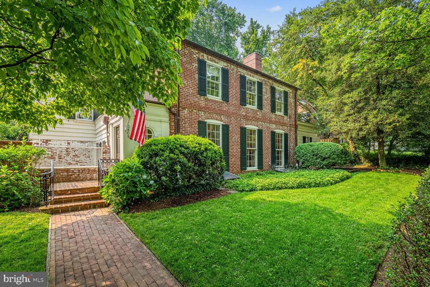 NEW LISTING! Welcome to this 4,500+ square foot home situated on desirable, tree-lined Leland Street in the Village of Chevy Chase, Section 5. The classic New England style façade complete with brick walkway, wrought-iron railings, and American flag blowing in the wind exemplifies quintessential Chevy Chase. A formal entry foyer with porthole window and generous coat closet open to a large formal living room with floor-to-ceiling windows, hardwood floors, crown molding and a wood-burning fireplace. The heart of the home is the enormous gourmet chef’s kitchen and large family room combination, a great room that will please even the most discerning buyer. The kitchen features top of the line appliances, vaulted ceilings, skylights, multiple sinks, a 6-burner gas stove with griddle, and an enormous, south-facing window ideal for windowsill herb gardening. Double French doors lead from both the kitchen and the large formal dining room to the exquisite multi-tiered terrace, with sound system and lights twinkling above. A quiet home office on the main level, a tucked away mudroom garage entry, and powder room enhance the charm and gracious appeal of the home. 
The upper level features four bedrooms and two full baths, including an ensuite primary bedroom. There is a fully floored attic with walk-up staircase with limitless possibilities for expansion or renovation. The large basement features high ceilings, a full bathroom, and a full-sized laundry room.
The exterior of the home boasts meticulous landscaping, and an underground irrigation system keeps the yard and gardens fresh and lush year round. The backyard is fully fenced to keep furry friends secure. An attached 2-car garage completes this perfect picture of comfort and elegance. 
The former residence of US Senator Charles Mathias, this fine home is located within walking distance to the Shops at Brookville, La Ferme, the weekly organic farmer’s market, and the highly-regarded CCUMC Preschool, which serves as a feeder to the award-winning Chevy Chase public school cluster. Section 5 in the Village of Chevy Chase is known for its larger lot sizes, classic architecture, friendly neighborhood gatherings, and generous community services. This home is eligible for membership in the popular CCRA Swim & Tennis Club.