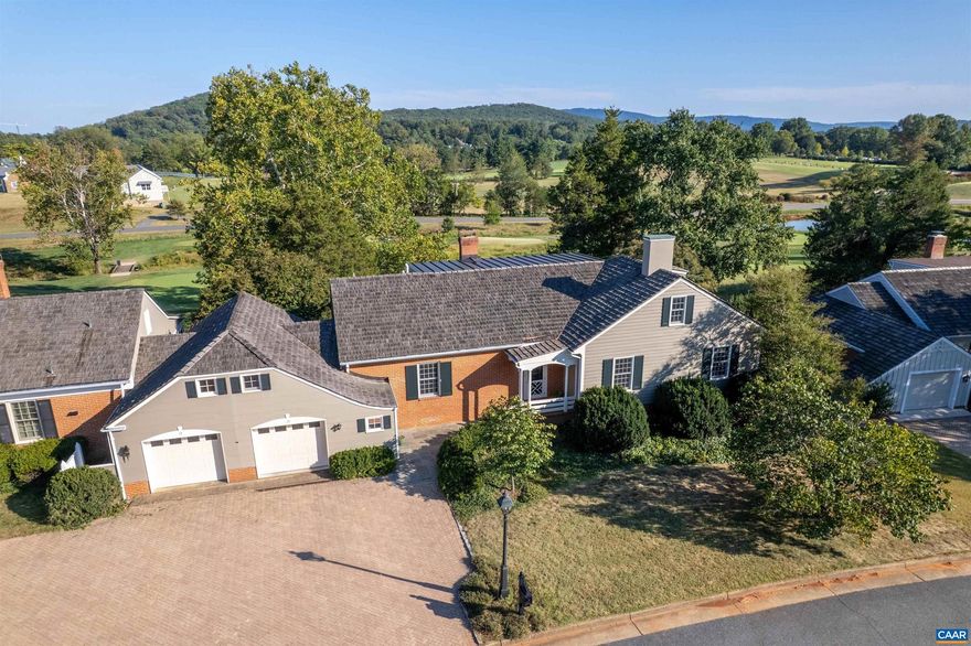 Light-filled home with spectacular views of the UVA Golf Course and Ragged Mountains. The open-concept floor plan includes a first-floor primary suite, spacious eat-in kitchen, library, custom Gaston & Wyatt millwork, built-ins, and a sunroom designed to capture natural light throughout the day. Additional features include hardwood floors throughout, a whole-house generator, one-car garage, and a large back patio overlooking the golf course. The level backyard is ideal for entertaining, while the home?s location offers unmatched convenience. Just moments from Boar?s Head Sports Club, UVA, Downtown, and all Charlottesville has to offer.,Glass Front Cabinets,Marble Counter,White Cabinets,Fireplace in Den,Fireplace in Living Room