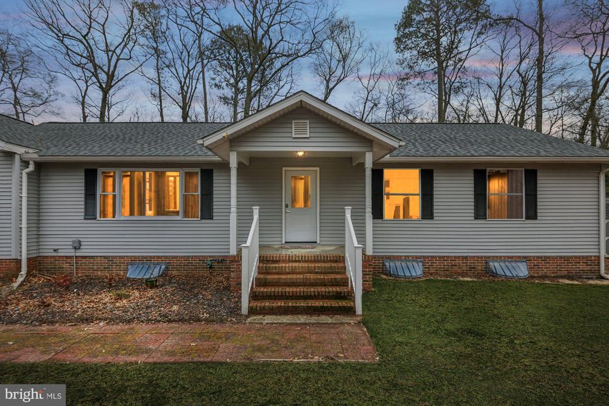 Discover the perfect balance of modern style and woodland tranquility at 1941 Wildwood Trail. Nestled on a premier one-acre cul-de-sac lot in the sought-after Wildwoods community, this beautiful 3-bedroom, 3.5-bathroom retreat offers a lifestyle of privacy without sacrifice.
Stepping inside, you are greeted by hardwood floors and an expansive, light-filled living room. The heart of the home is the thoughtfully designed kitchen, featuring a massive center island accented by pendant lighting, sleek granite countertops, and upgraded soft-close cabinetry. Outfitted with premium stainless steel appliances and a generous walk-in pantry, this space is as functional as it is beautiful.
The luxurious spa-like full bath with custom tile work and a large walk-in shower is certain to impress, while the finished lower-level family room provides room to spread-out. Outside, you can relax on the oversized 29 x 10 rear deck overlooking a private, fenced backyard that is ideal for summer BBQs and peaceful morning coffee. This home offers true peace of mind with a roof less than two years old. The long, pristine asphalt driveway leads to your attached 2-car garage which comes pre-wired for your electric vehicle charger, and for those who love to entertain, the custom bar can stay. Enjoy the additional storage of a 10x16 Highwall Dutch shed with 5 foot ramp.
This tucked away location affords peace and tranquility, while also allowing you to choose your adventure! Whether you’re heading to the sands of Ocean City, Assateague Island, Chincoteague, shopping and dining in Salisbury or just launching a kayak on the scenic Pocomoke River, this home puts the best of the Delmarva Peninsula within easy reach. Opportunities in this quiet cul-de-sac are rare—schedule your private tour today before this hidden gem is claimed.