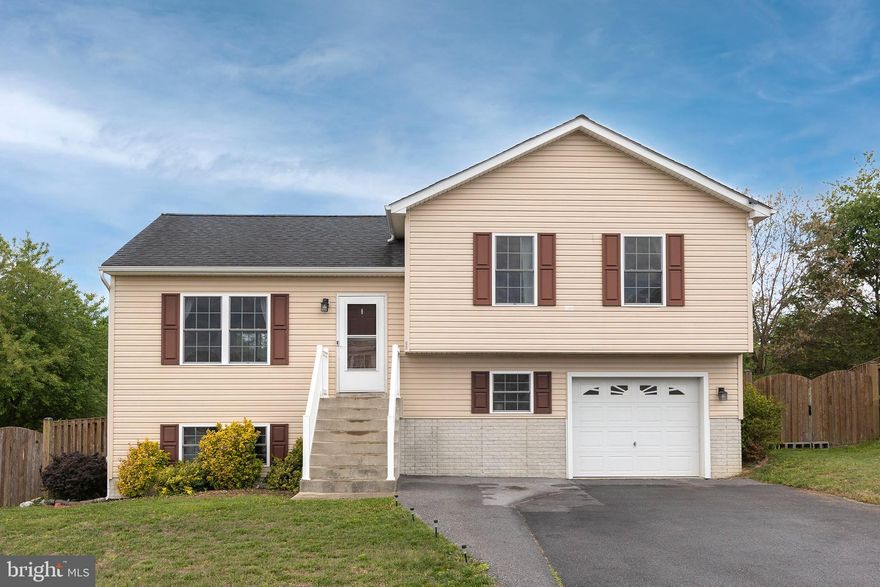 Split level home in great commuter location on the east side of Inwood, WV. Step inside and you are greeted to an open floor plan featuring living room, dining and kitchen with vaulted ceilings.  The back deck overlooks the private fenced-in backyard. Upstairs you'll find 3 bedrooms and 2 baths. Head down to the walk-out basement to the large family room and 3rd full bath that is perfect for entertaining. One car garage currently set up as a gym/work-out area.