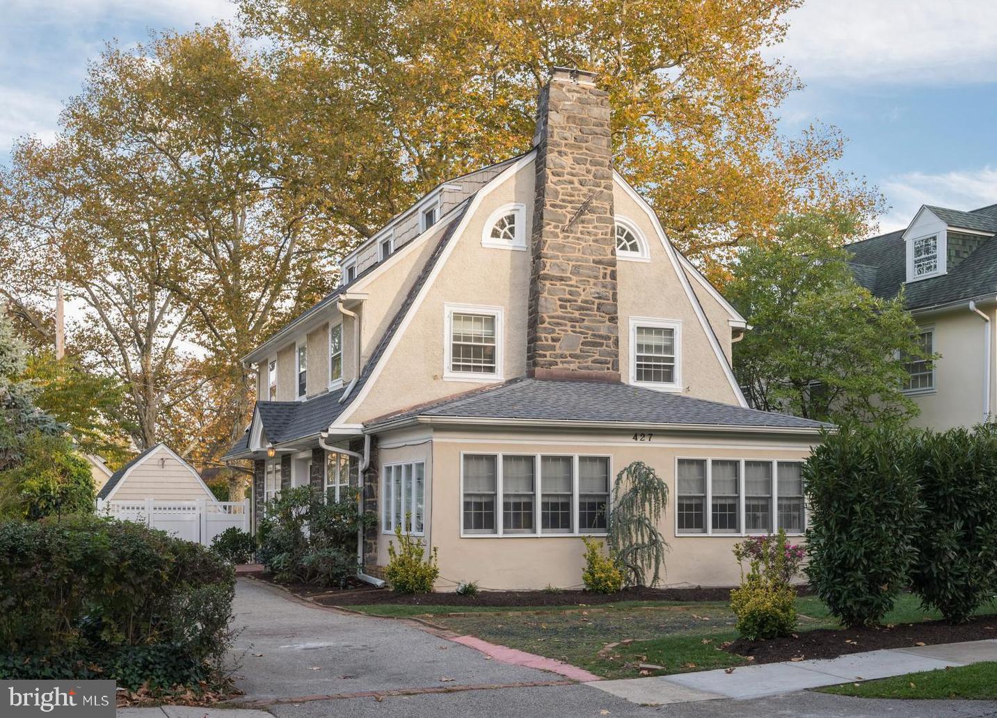 Welcome home to 427 Levering Mill in Bala Cynwyd, Lower Merion Township. A charming, updated single-family home in a walkable neighborhood. Just steps away from Cynwyd Elementary and Bala Middle schools, shopping, public transportation, SEPTA Cynwyd Station, places of worship, coffee shops, and more. Enter into a spacious foyer, to the right is a large living room where a stone fireplace is a focal point. French doors on both sides of the fireplace open to a fabulous sunroom with hardwood floors, exposed stone, crown molding, and recessed lighting. The space is perfect for an in-home office, play area, or sitting room to relax with your favorite book. The chef’s kitchen is on the opposite side of the foyer and boasts Shaker-style navy cabinets around the perimeter of the room, quartz counters and backsplash, stainless steel appliances, 48” AGA range with hood, and a beverage center. The center island in natural wood provides additional seating, a dishwasher, and a stylish farmhouse sink. A built-in banquet and barndoor-style chalkboard provide even more character to the kitchen. Sun pours in through double glass doors that provide access to the deck and backyard. A powder room completes the first floor.  A beautiful staircase leads you to the second floor. Here you will find the primary suite with hardwood floors, crown molding, and recessed lighting. A full bathroom with tub/shower combo is located adjacent to the primary bedroom. There are two additional, good-sized bedrooms on this level. The third floor offers the fourth and fifth bedrooms.  They share a full bathroom with double vanity. An unfinished basement provides an abundance of storage and Bilco doors provide easy access for moving items in and out. The backyard is perfect for entertaining. Enjoy grilling and dining al fresco on the composite deck then step down to a grassed area perfect for play or letting your four-legged friends run. And there’s even a swim spa to relax. One Car detached garage. Located in award-winning Lower Merion School District.