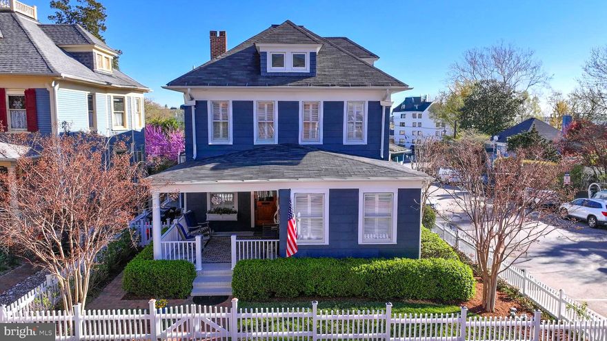 LOCATION!  Welcome to one of downtown Annapolis’ most exceptional offerings. Perfectly positioned in the heart of the Historic District, 98 Duke of Gloucester Street is the kind of property Buyers wait years to find. Set on one of the widest, two-way streets downtown, this rare residence offers the convenience of being just steps from the waterfront, restaurants, shops, and the charm that makes Annapolis so special—while maintaining a sense of privacy rarely found in the city.
Parking is truly unmatched, with four dedicated spaces including two garages (with EV charger), a private driveway, and a parking pad—an extraordinary amenity in the Historic District.
This American Four Square home features 4/5 spacious bedrooms and three full baths, with beautifully designed living and dining spaces that flow seamlessly for both everyday living and effortless entertaining. Elevated above street level, the property enjoys enhanced privacy and light. The main level includes a parlor with a gas fireplace that you could convert to a bedroom and full bath, offering flexibility for guests, office space, or multigenerational living.
Thoughtful upgrades blend modern comfort with timeless character. Recent improvements include a newer kitchen island, a porch enclosure with mini-split HVAC (2019), and a floating deck with a new roof off the primary bedroom (2023)—creating inviting outdoor spaces for relaxing and entertaining. Practical enhancements provide peace of mind, including two new HVAC systems (2025) and a hot water heater with recirculating pump (2026). Bump outs in the family room, dining room and primary bedroom enhance the living spaces.
Craftsman-inspired fir siding, a fully fenced private yard with amazing landscaping, and multiple outdoor living spaces complete this rare downtown offering.
A property that combines historic Annapolis charm, modern updates, exceptional parking, and walkable convenience—this is downtown living at its very best!