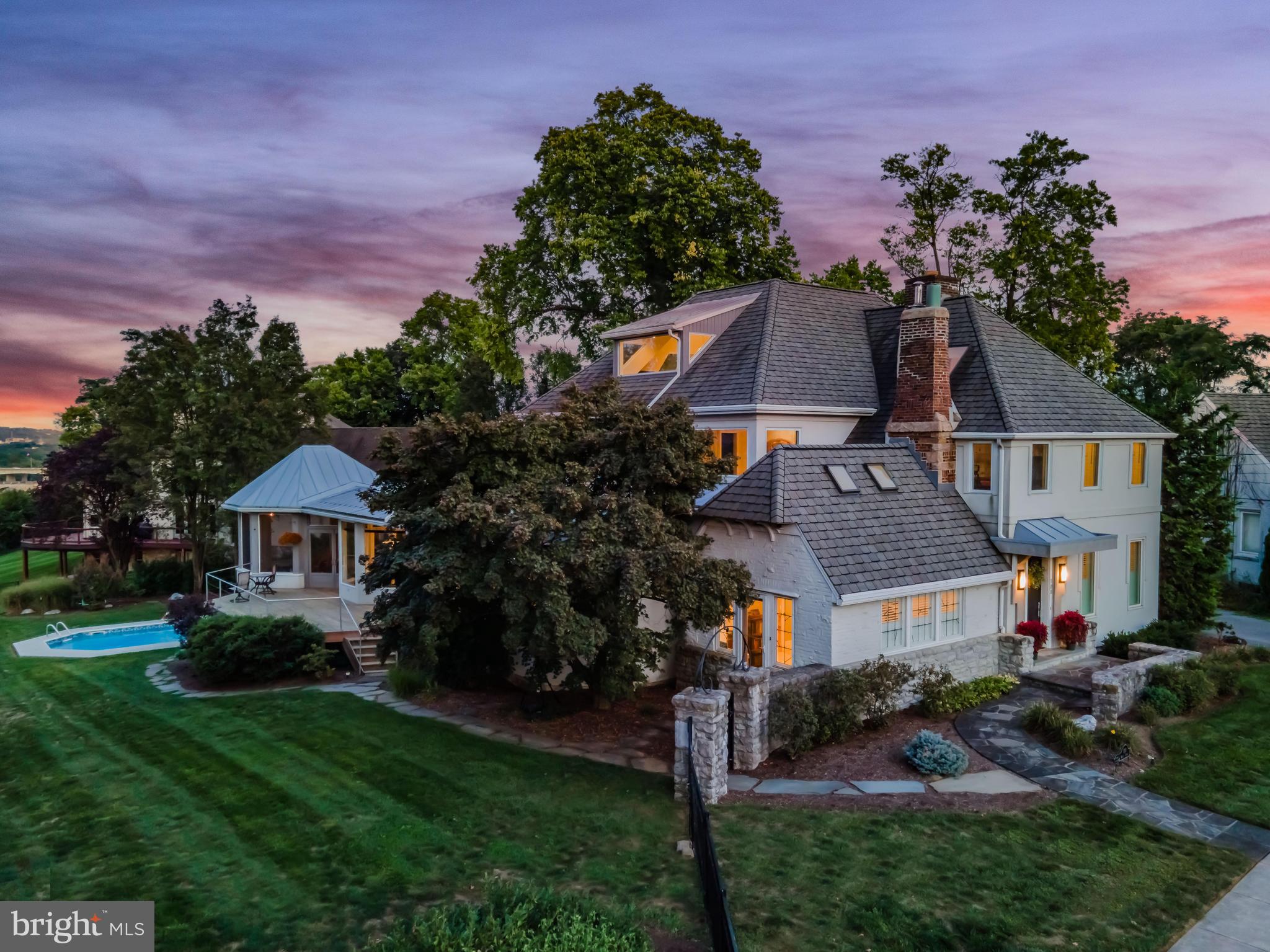 Welcome to this stunning single-family home at 100 Walnut St, Lemoyne, where historic charm meets modern elegance. This exceptional property features 5 spacious bedrooms and 3.5 beautifully appointed bathrooms, offering ample space for comfortable living. The impressive 5,274 sq ft layout seamlessly blends original architectural details with contemporary updates thanks to renowned architect, Duryea Cameron.
Enjoy breathtaking views of the city of Harrisburg, Pennsylvania State Capital and the picturesque Susquehanna River from three levels of this home. Revel in the spectacle of fireworks from your own vantage point, making every celebration a memorable experience.
The expansive main living areas are perfect for both entertaining and relaxation, highlighted by large windows and 13 skylights that fill this home with natural light. Enjoy the ease of hardwood floors throughout the home. The kitchen boasts modern appliances and stylish finishes, making it a dream for any home chef. Primary suites available on both the 1st & 2nd floor. To complete the 1st floor is a home office, part of the original section of the house. Original beams & windows give this space amazing character. A unique loft space and a spiral staircase lead to a beautiful conservatory, providing an ideal spot for relaxation or creative pursuits.
Take advantage of your private swimming pool while soaking in the stunning views. This home features more storage than you will ever need. There is a generous 3-car garage with an additional bonus room above, uses are endless.
Walking distance to Negley Park, close to downtown Harrisburg, shopping, restaurants and major highways.