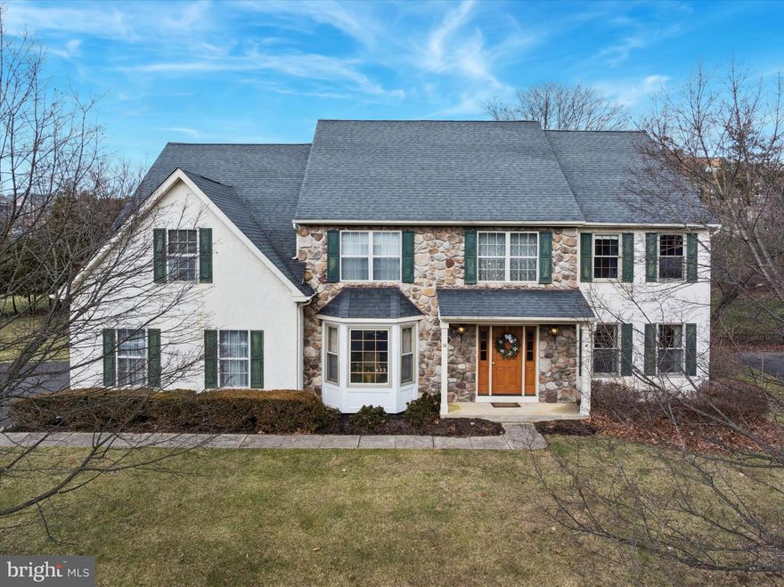 Location, Location, Location!
Welcome to 14 Villa Drive, situated in the highly sought-after Ballantrae neighborhood of Ambler within Upper Dublin Township. This French-style colonial built by Westrum features a striking stone and stucco exterior with exceptional curb appeal.
Upon entering, you are greeted by a light-filled, two-story foyer. To the right is a comfortable, carpeted formal living room, while the formal dining room boasts an elegant bay window and classic wainscoting. The layout flows seamlessly into a spacious eat-in kitchen featuring granite countertops, stainless steel appliances, wood cabinetry, and a dedicated desk workspace. From the kitchen, sliding doors lead to a stone-walled block patio.
The kitchen overlooks the family room, which features cathedral ceilings and a wood-burning fireplace. The main level also includes a versatile office or den, a powder room, and a laundry room with convenient access to both the backyard and the two-car garage.
The second floor is accessible via dual staircases that meet at an open landing. To the right are two bedrooms with deep closets. To the left​ and down the open hallway​, double doors open to the primary suite, which features vaulted ceilings, a sitting area, a spacious walk-in closet, and an ensuite bath with a soaking tub and separate shower. A fourth bedroom and a full hall bath complete this level.
The 39’ x 29’ finished basement offers extensive flexible space, including multiple closets and an additional unfinished storage area. Outside, the patio leads to an expansive flat yard​ that is partially fenced.
This prime location offers easy access to Fort Washington Elementary School, Route 309, and local parks. It is also just minutes from downtown Ambler, known for its historic theater, popular restaurants, local businesses, and SEPTA regional rail to Center City Philadelphia.​ Location, Location, Location!