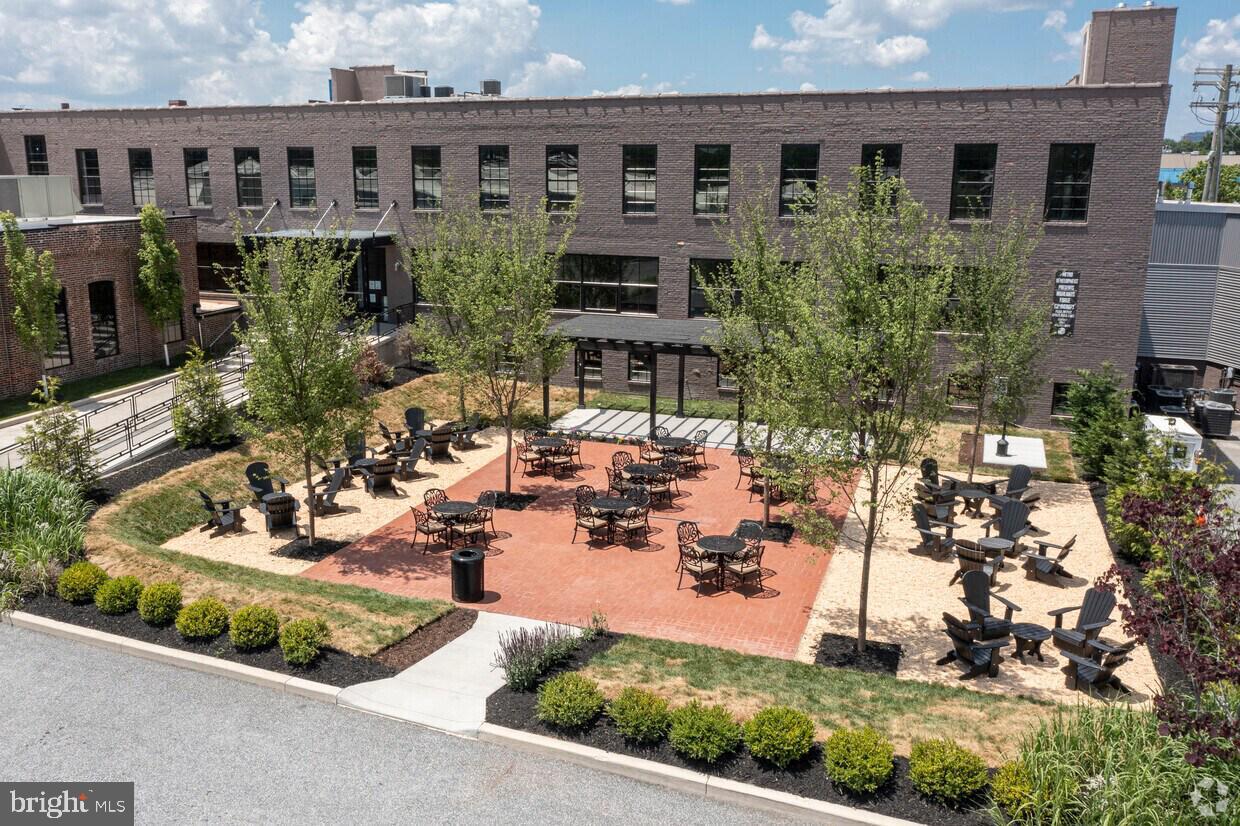 Step into sophistication with this expansive 6,800 SF first-floor suite located in the dynamic Highlands Forge community along Haven Street. Nestled behind a gated entrance, this thoughtfully designed mixed-use development offers a rare blend of historic charm and modern amenities, creating a vibrant yet refined setting that feels worlds away from the hustle of the city—yet is just minutes from Canton, Harbor East, Fells Point, Butcher's Hill, and the Inner Harbor and Best of all, the Tenant pays no pass-throughs—offering true all-in value and cost predictability. This exceptional suite is ideally situated between Monument City Brewing and the newly opened Motte Restaurant, offering a private exterior entrance with direct access to a secured 600-car parking lot. The space is bathed in natural light and features an open-concept layout, ADA-compliant restroom, and kitchenette, making it ideal for a variety of professional, creative, R&D, or non-profit uses. Inside, you’ll find high-efficiency HVAC, LED lighting, and stylish exposed ceilings—all designed for comfort and sustainability. Highlands Forge tenants enjoy access to a state-of-the-art fitness center, multiple outdoor courtyards with grills and lounge areas for entertaining or relaxing. On-site amenities include two breweries, an axe-throwing venue, the Baltimore ballroom for private events, and upscale dining and cocktails at The Motte, which recently opened to rave reviews.
Located within a designated Enterprise Zone, this property offers potential employment tax credits for qualifying businesses—adding meaningful financial incentives to an already exceptional offering. Don’t miss the opportunity to position your business in a truly distinctive environment that fosters collaboration, community, and connection. With ongoing events, planned activities, and a culture of reciprocal support among tenants, Highlands Forge is more than just a workplace—it’s a thriving professional community.