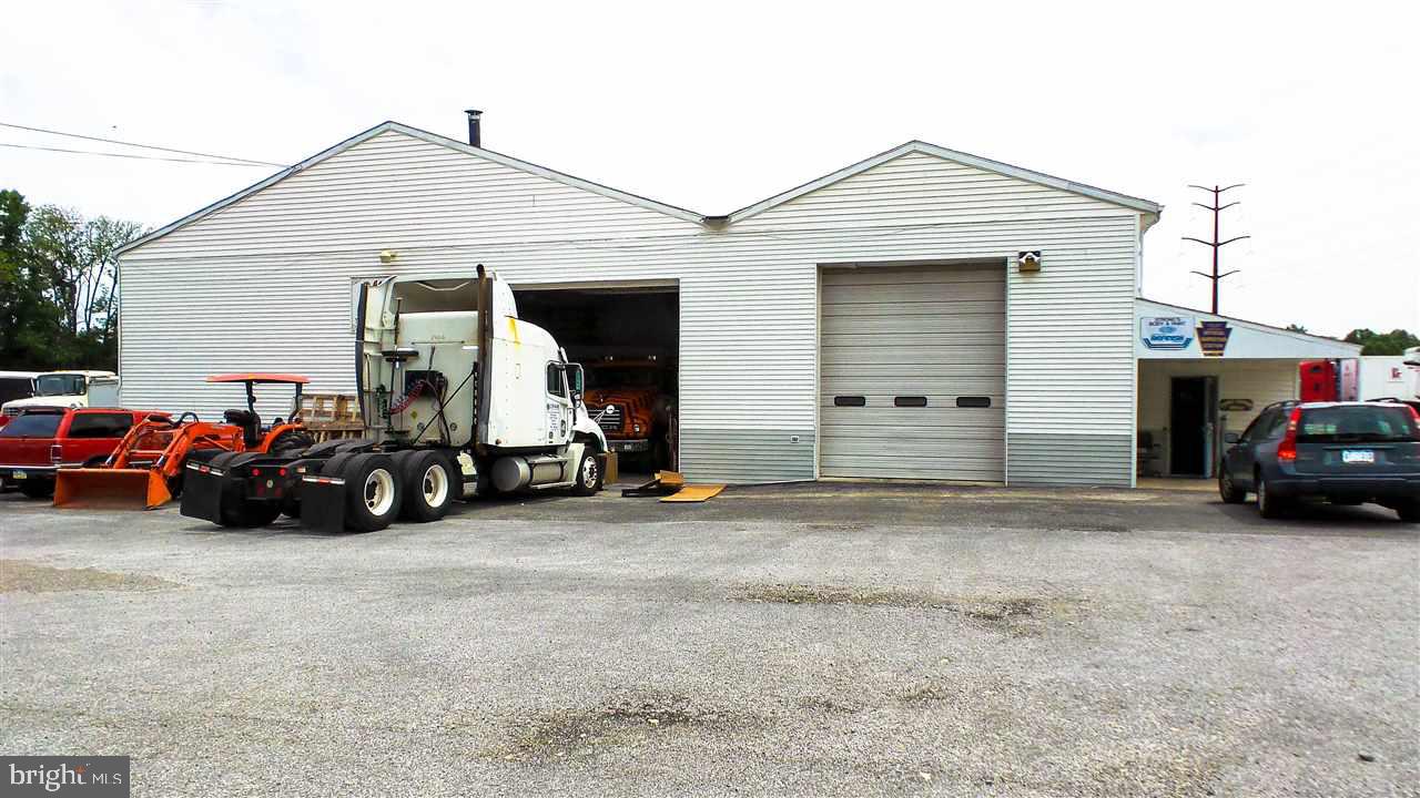 Strongs Body Paint Shop - Auto service garage. This concrete block & steel structure is located in a comm zone in Newberry Twp w/ 4,836 SqFt on the 1st floor of building 1 & 520 Sq.Ft. on the 1st flr of building 2. Building 1 is 60x50 and building 2 is 60x30 apprx. This body shop has 5 lrg bay drs which are over 14' in ht. The owner would will prov financing to a qualified buyer, and seller will lease to qualified tenant. Please see Associated Documents for full details of this property.