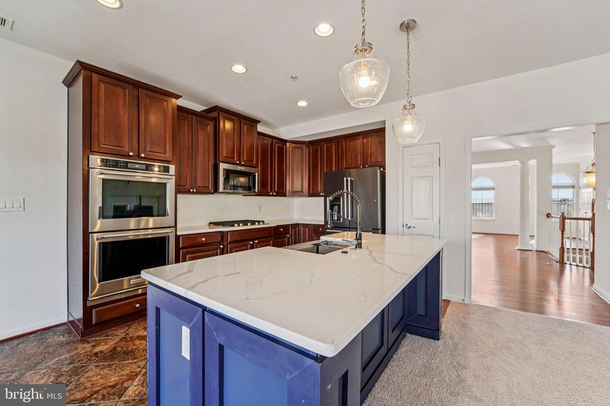 Location, Light, and Luxury! This impeccably maintained end-unit townhome offers the size of a single-family home with the "lock-and-leave" convenience. The seller has done all the heavy lifting—enjoy brand-new carpeting, fresh paint, and updated fixtures. As an end unit, you’ll enjoy added privacy and an abundance of windows that interior units lack. The attached garage provides secure parking and extra storage, while the location is ideal for shoppers and commuters alike.  Perfectly situated for the modern lifestyle, you are just seconds from Wegmans, Mill Station, and I-795. Why settle for an interior unit when you can have the extra light and privacy of this gorgeous end-of-group gem? This unit is BUYER ready with the updated and upgraded features you MUST SEE.  Photos for this listing have been virtually staged.