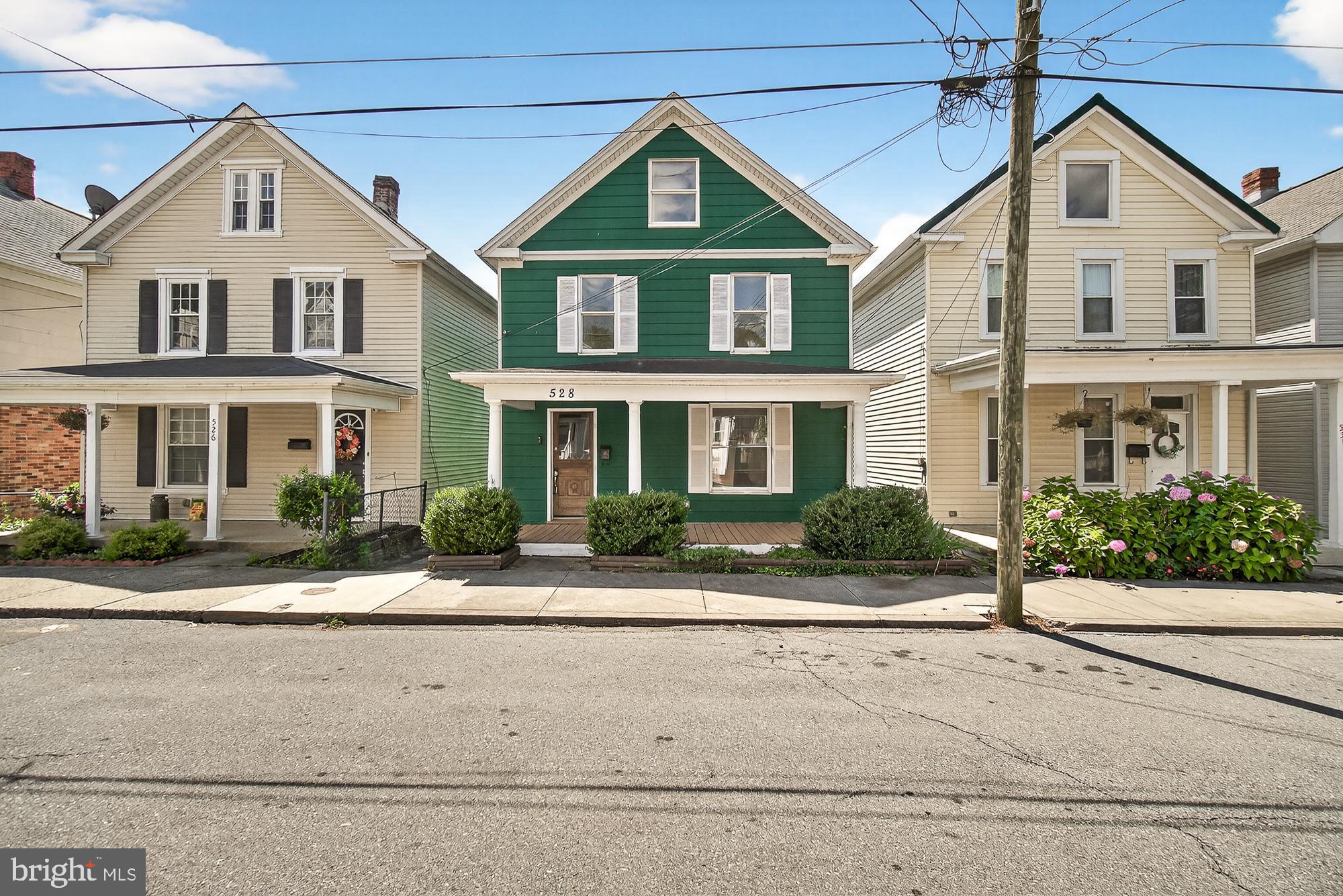 Welcome to Brunswick! This beautifully renovated home combines small-town charm with modern updates in the heart of historic southern Frederick County, Maryland. Enjoy the vibrant community and outdoor recreation along the scenic Potomac River—all just minutes from your front door. Walk inside to a bright living area with built-in bookshelves and an adjoining dining room. The spacious kitchen boasts sleek quartz countertops, plenty of cabinetry and energy-efficient appliances. A convenient half bath and laundry room with backyard access complete the main level. Upstairs, you’ll find three large bedrooms and two full baths, including a private primary suite. A walk-up attic adds extra storage and potential for a bonus room. Outdoor features include a welcoming front porch, expansive rear deck, and storage shed. The private paved driveway offers three dedicated parking spaces. Move-in ready and USDA eligible—this home is ready for you!