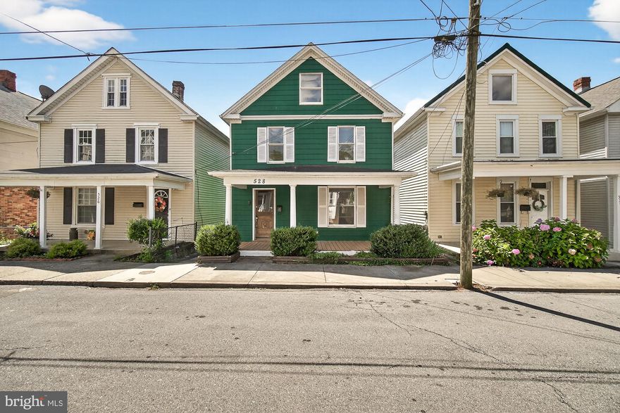 New-Improved Price! Welcome to Brunswick! This beautifully renovated home combines small-town charm with modern updates in the heart of historic southern Frederick County, Maryland. Enjoy the vibrant community and outdoor recreation along the scenic Potomac River—all just minutes from your front door.  Walk inside to a bright living area with built-in bookshelves and an adjoining dining room.  The spacious kitchen boasts sleek quartz countertops, plenty of cabinetry and energy-efficient appliances.    A convenient half bath and laundry room with backyard access complete the main level.  Upstairs, you’ll find three large bedrooms and two full baths, including a private primary suite. A walk-up attic adds extra storage and potential for a bonus room. Outdoor features include a welcoming front porch, expansive rear deck, and storage shed. The private paved driveway offers three dedicated parking spaces.  Move-in ready and USDA eligible—this home is ready for you!