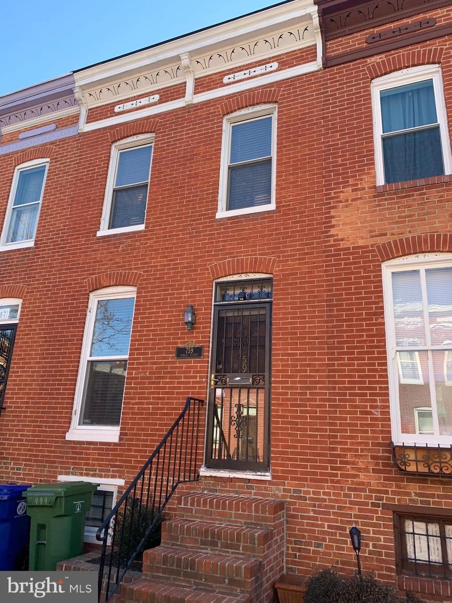 This amazing brick townhome is waiting for you to call it your very own. Enter the home to the bright and airy open floor plan featuring a natural light filled living room and beautiful brick wood burning fireplace, great for gathering and watching your favorite TV show. Entertain friends and family in the dining area. Prep, create, and serve a meal in the eat-in kitchen complete with tons of storage space, modern lighting, and laminate countertops - along with access to the rear yard. Rest and retreat in your primary bedroom featuring brick walls, large windows, and exposed beams. This level has space to make an additional bedroom as well. A chic full bathroom finishes off the top level. Transform the unfinished lower level into your dream entertaining space. Step out onto the deck ideal for BBQ and endless summer fun, overlooking the fully fenced in backyard. This home is conveniently located near shops, restaurants, and Oriole Park. What are you waiting for? Schedule your showing today! Other Updates include: Roof & HVAC are 2019.