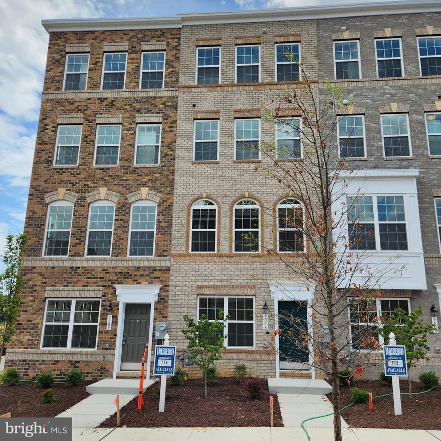 AVAILABLE NOW: Skytowns 42 Model (42) Stunning 4-Level Urban Townhouse with a Private 2-Car Garage. This INTERIOR UNIT offers ultimate privacy and abundant natural light. Enjoy the Rooftop Terrace with panoramic views. The interior boasts a spacious layout with 3 Bedrooms and 3.5 Bathrooms. The elegant brick front and cozy fireplace add charm to the home. The kitchen features modern stainless steel appliances and sleek Quartz countertops. Luxury Vinyl Plank flooring enhances the main level, while the bathrooms are adorned with stylish Ceramic Tile. Additional upgrades await you. Take advantage of our No Down Payment loans, with $14,000 towards Closing costs. Don't miss out on this exceptional opportunity!