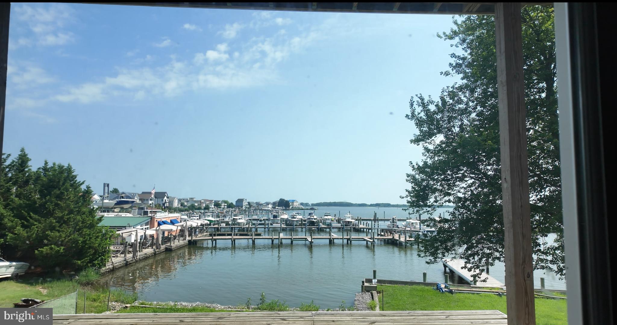 Located on the eastern side of Baltimore County in the Sparrows Point, this property offers direct views of the Chesapeake Bay in an area well known for its boating and waterfront lifestyle. The surrounding shoreline is lined with marinas and piers, and popular local restaurants such as Dock of the Bay, Max Feeds, and Row Boat Willies Dock Bar are just a short drive away.
According to when the property was sold at auction previously, the lot offers approximately 50 feet of water frontage and totals about 9,282 square feet (0.21 acre). The home currently on site is a partially constructed, five-level residence. The design includes a first level garage and storage area, large open spaces with front and rear decks on the second level, three bedrooms, two bathrooms, and an additional deck on the third level, one large open room plus a bedroom and bath space on the fourth level, and attic space on the fifth level.
Buyers should note the property is subject to a Baltimore County enforcement citation/violations. Any buyer is strongly encouraged to review the disclosures in detail or contact the permit office directly with questions regarding violations.