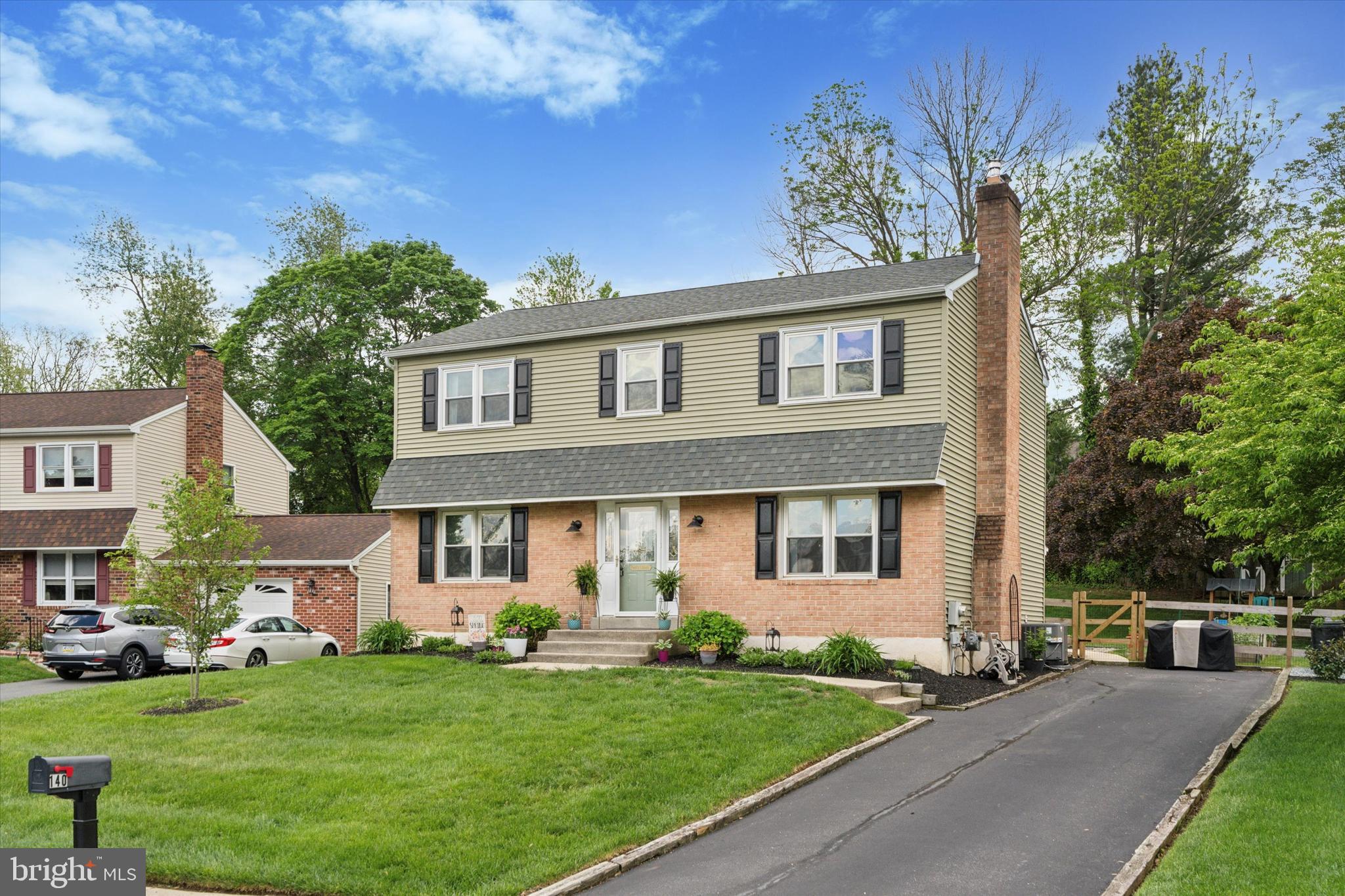 Truly Move-In Ready! Current owners have lovingly updated this 4 bedroom Colonial home with stylish upgrades inside & out. This home offers comfort, function, and style throughout. Step inside to find a tiled entry leading to an inviting kitchen featuring a butcher block island, electric GE appliances, including a side-by-side refrigerator with bottom freezer, a stone backsplash, a pantry closet, and a cozy eat-in area. The family room has hardwood floors, a wood-burning stove, and a ceiling fan. The powder room has been updated and so has the laundry room with cabinets and Maytag washer and dryer. Step outside to large, screened in patio that overlooks the fenced in back yard. Upstairs, hardwood floors continue throughout the hallway and all bedrooms. The primary suite features an accent wall, ceiling fan, walk-in closet, and an en-suite bath with stall shower, upgraded lighting, and a medicine cabinet. Three additional bedrooms include generous closets, and ceiling fans, The hall bath includes a tub/shower combo. Additional notable features include updated lighting throughout, newer windows, updated 200 amp electric panel(2020), roof (2019), fence (2023),hot water heater(2024), and HVAC(2024), hardwood flooring added to family room and 2nd floor. Call the movers, this home is move in ready!