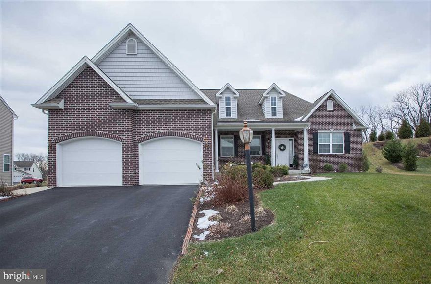 Lower Paxton Township ranch style home with 4 Bedrooms, 2 Baths, 2083 sq ft, built in 2010, Mognolia Model, rounded corners in walls, Zodiak counters in kitchen, gas fireplace, breakfast nook, 2 arches in open dining room that has hardwood floors, mud room area, 1st floor laundry, walk-up attic from garage with attic fan, very large basement with bilko door for entrance from outside, 2 car garage with door openers, 10 foot by 15 foot patio, gas generator, nicely landscaped backyard.