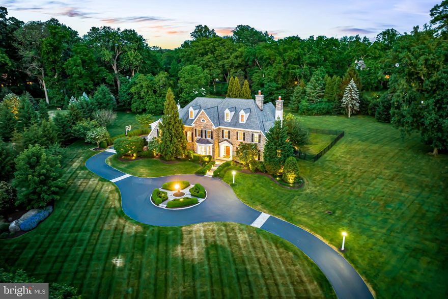 This truly exceptional sun-filled Devon Estate is set on a glorious 2.32 acre lot on a quiet cul-de sac, complete with a stunning pool and spa, new flagstone terraces and walkways and irrigated professionally designed landscaping.   This residence offers superior custom Pohlig construction, with exquisite materials, stunning architectural details and spacious designs throughout. Features include breathtaking 10' and vaulted ceilings on the first floor 9' and vaulted ceiling heights on the second floor,  3 fabulous gas fireplaces, bright windows capturing beautiful views of the private grounds, gracious room sizes with a wonderful open flow, fabulous gourmet kitchen with new SubZero, Dacor and Gaggenau appliances, rich oak floors, finely crafted millwork, moldings and casements, luxurious marble baths,  completely renovated spacious in-law suite,  a fully finished lower level with commercial rubber tiled floormat, media room, wet bar with wine cellar and full bathroom, attached 3- car garage, additional detached 2- car garage, new systems, generator, pool equipment,  new carpeting,  freshly painted neutral decor, and new insulated and partially conditioned 3rd floor lacrosse/ golf/ recreation cage with turf, custom netting, goal/ bounceback . Move right in and enjoy the serene setting while being just minutes away from renowned TE and Private schools, trains, equestrian, golf and recreational facilities, incredible restaurants, shopping and more. A real treasure.